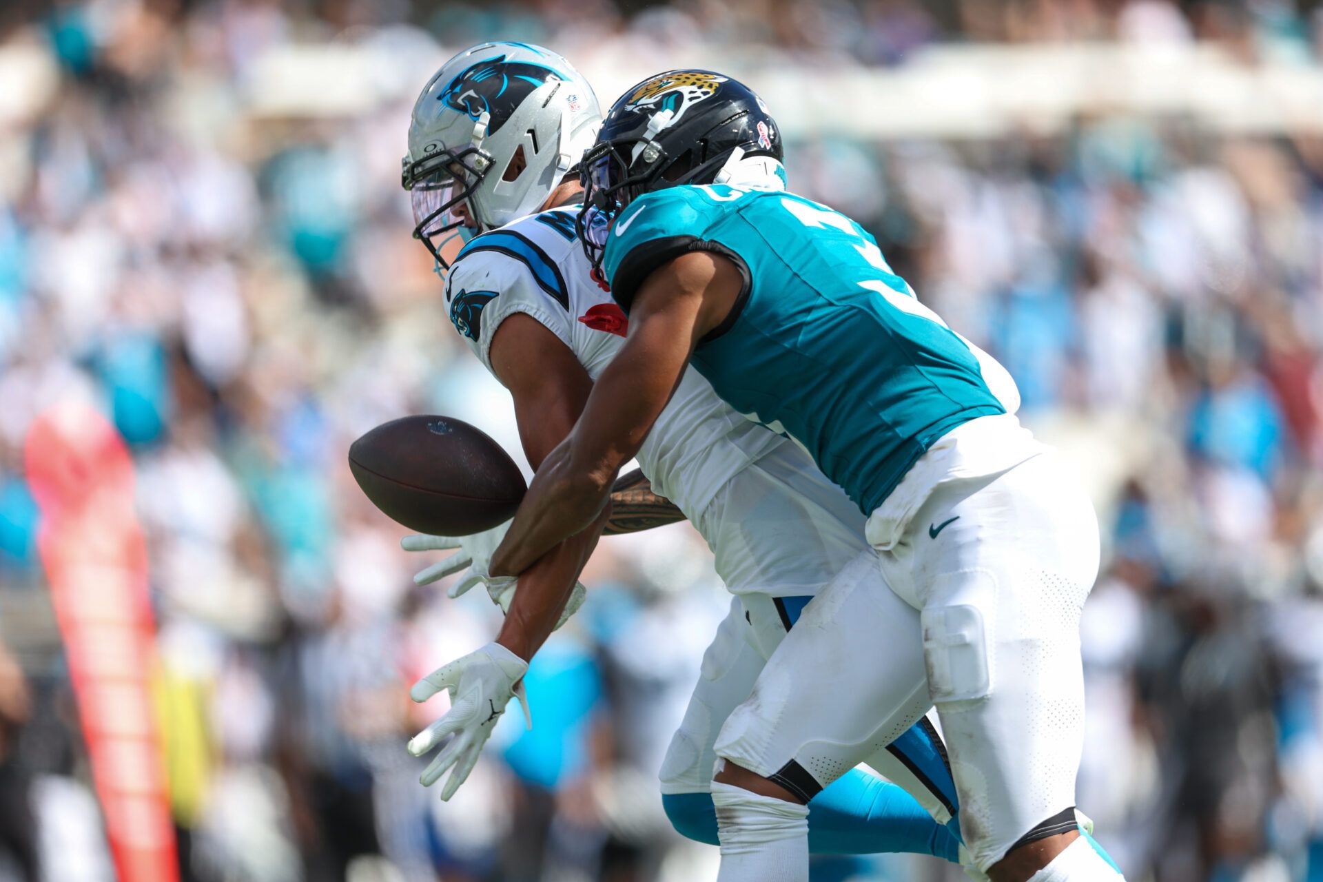 Jacksonville Jaguars cornerback Tyson Campbell (3) defends Carolina Panthers wide receiver Tetairoa McMillan (4) during the second half at EverBank Stadium.