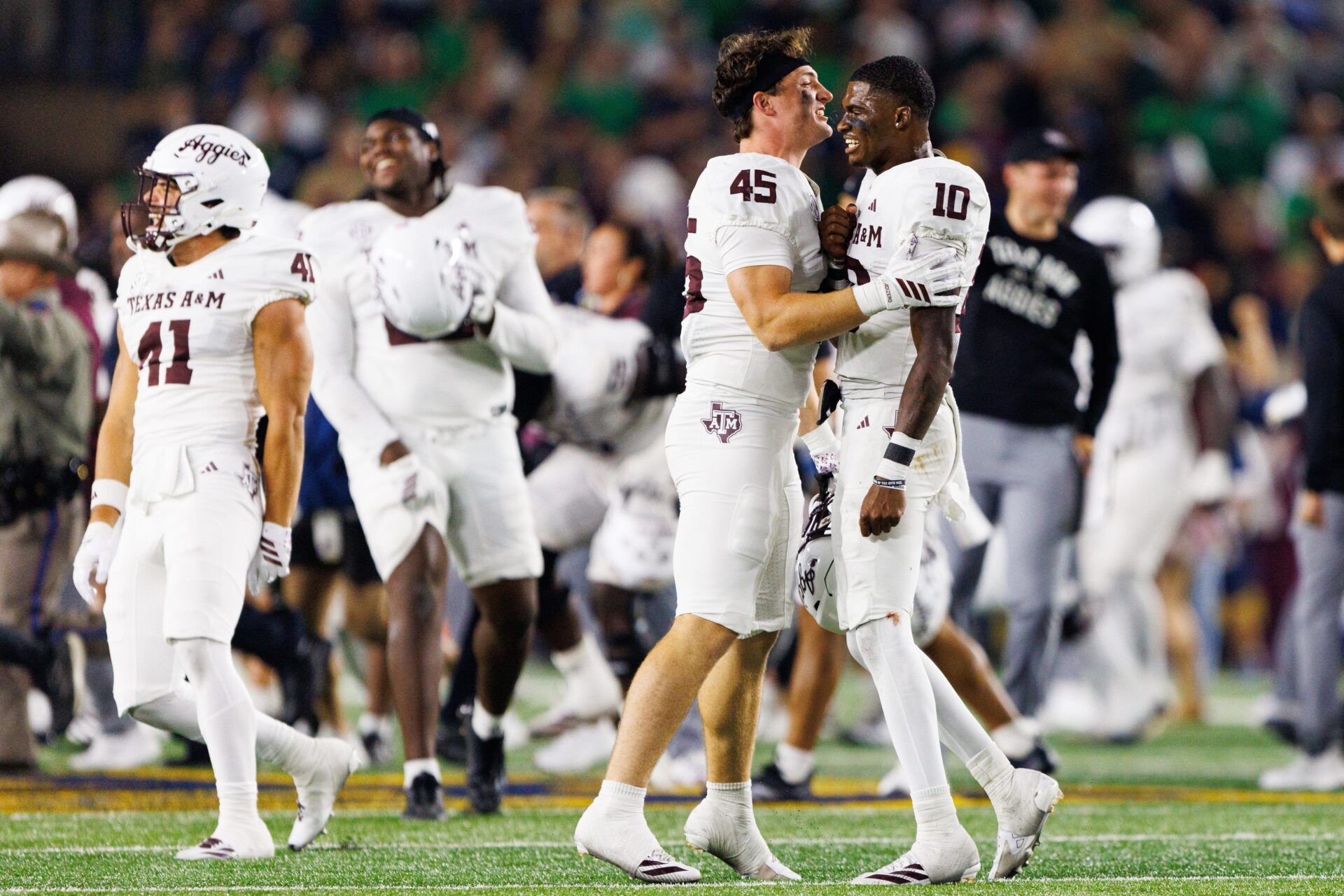 Texas A&M long snapper Levi Hancock (45) and quarterback Marcel Reed (10) celebrate after winning a NCAA football game 41-40 against Notre Dame at Notre Dame Stadium on Saturday, Sept. 13, 2025, in South Bend.