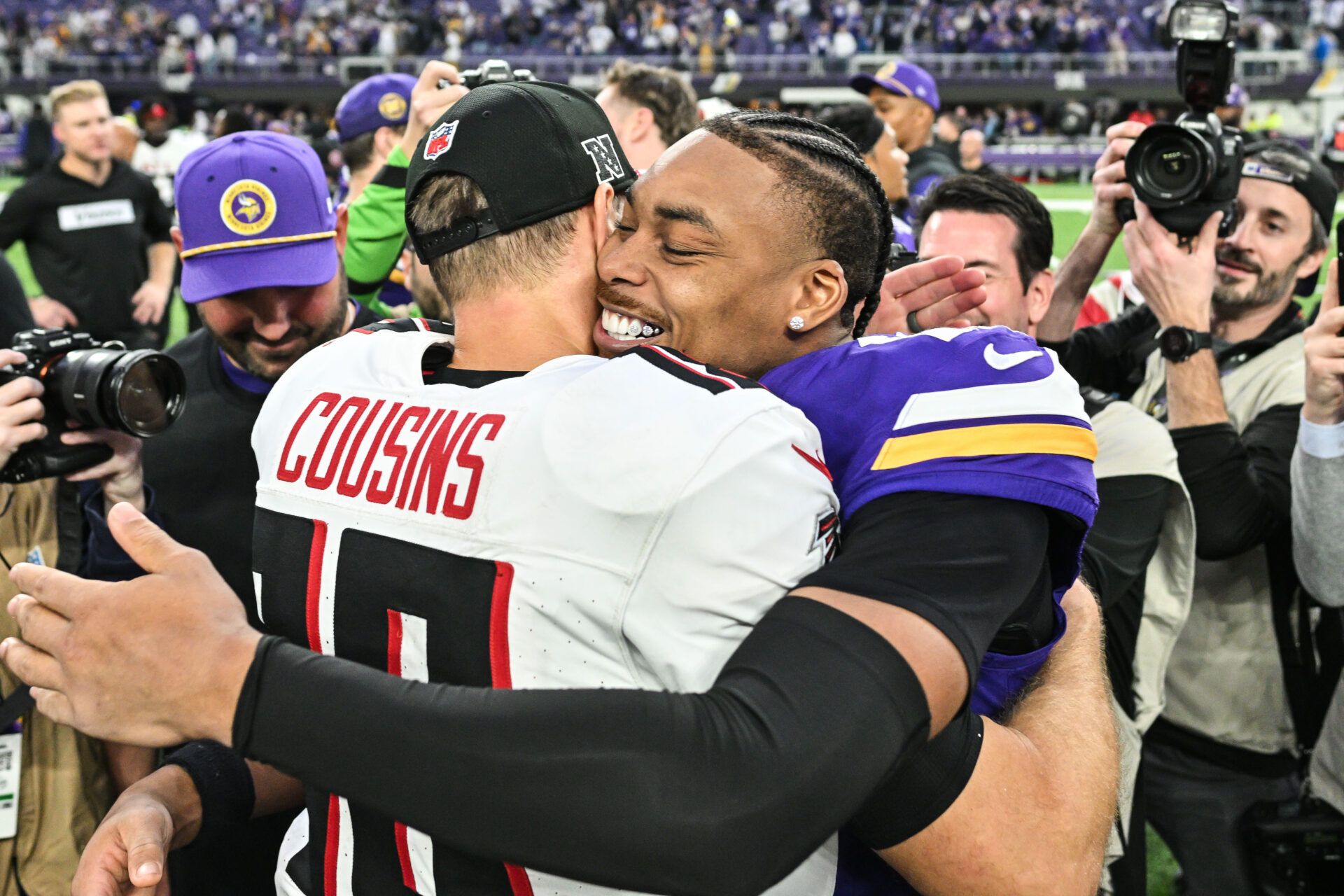 Atlanta Falcons quarterback Kirk Cousins (18) and Minnesota Vikings wide receiver Justin Jefferson (18) greet each other after the game at U.S. Bank Stadium.