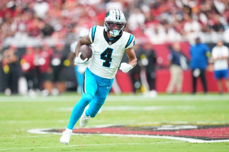 Carolina Panthers wide receiver Tetairoa McMillan (4) runs with the ball during the first quarter against the Arizona Cardinals at State Farm Stadium.