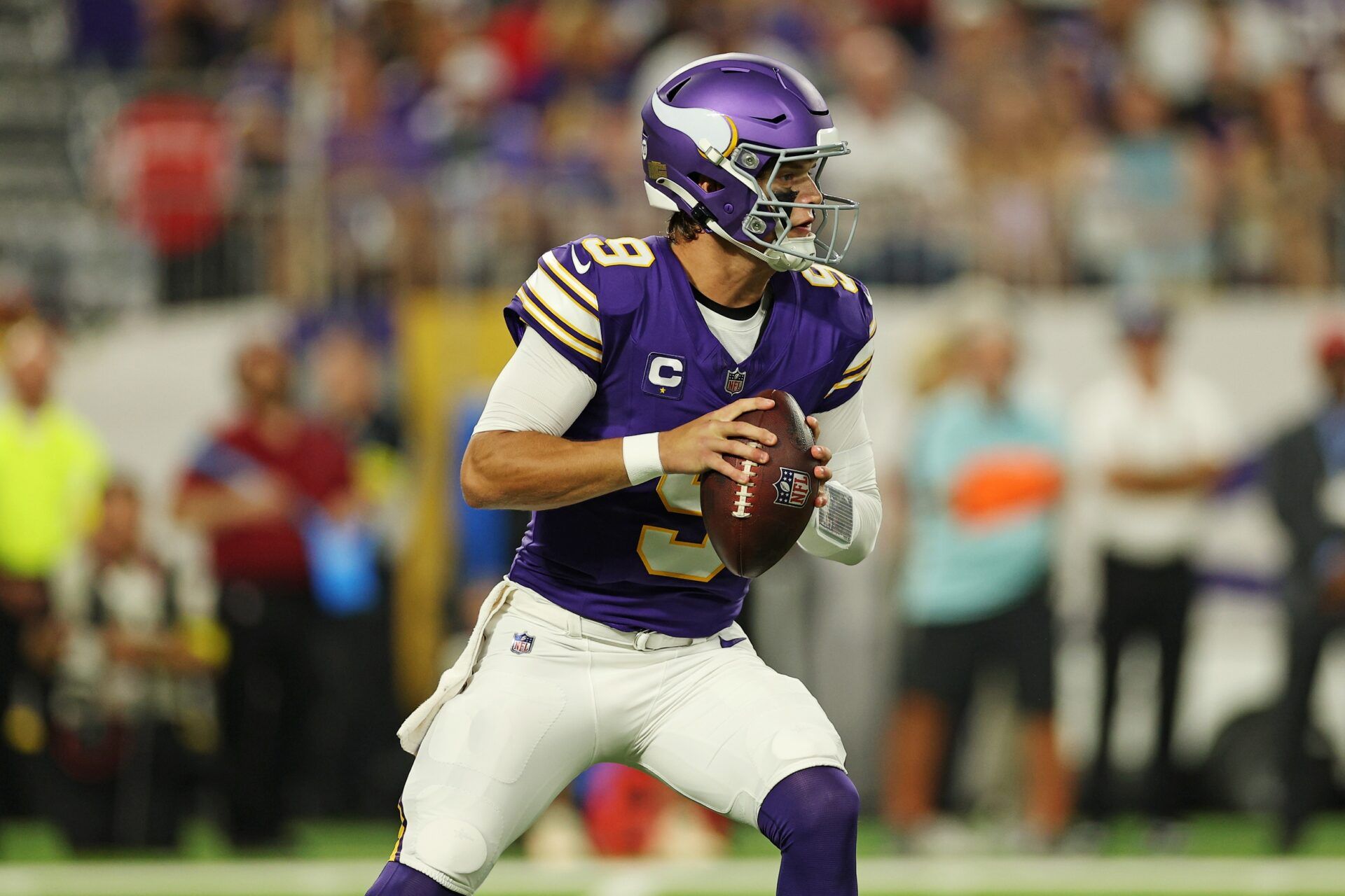 Minnesota Vikings quarterback J.J. McCarthy (9) looks to make a pass during the first half against the Atlanta Falcons at U.S. Bank Stadium.