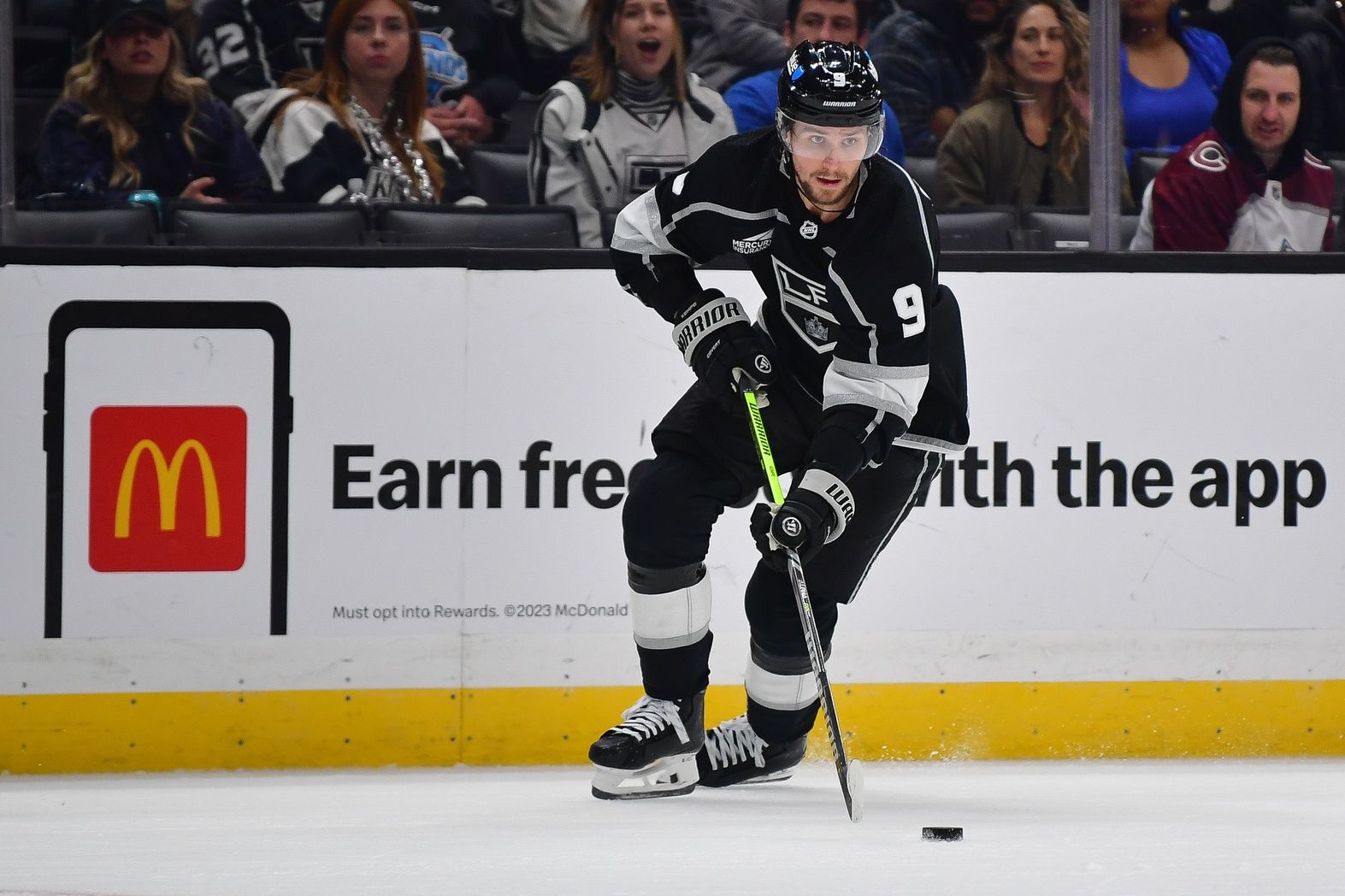 Los Angeles Kings center Adrian Kempe (9) moves the puck against the Colorado Avalanche during the second period at Crypto.com Arena.