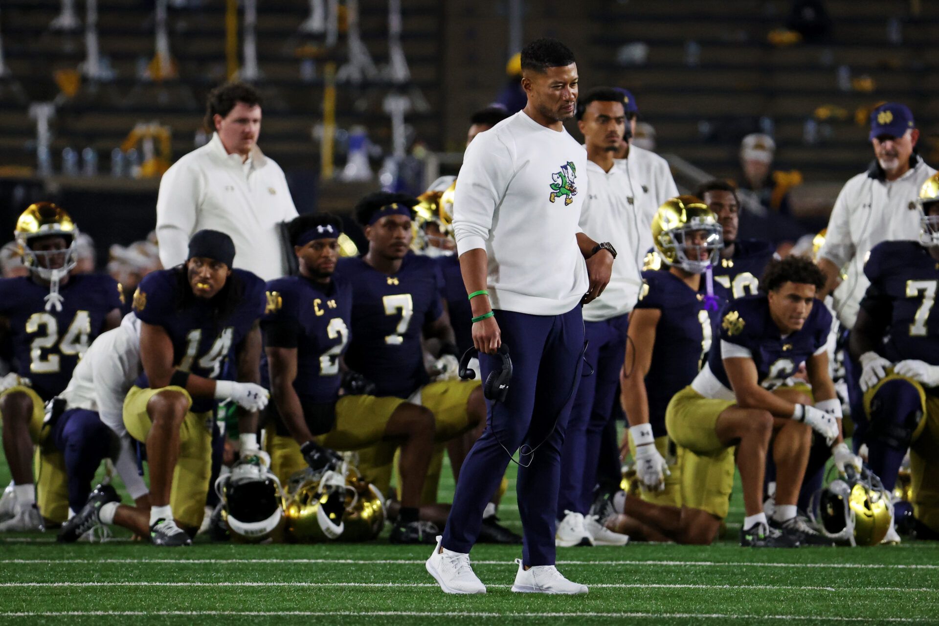 Notre Dame Fighting Irish head coach Marcus Freeman looks on as the team takes a knee for Notre Dame Fighting Irish tight end Eli Raridon (9) after an apparent injury against Texas A&M Aggies during the second half at Notre Dame Stadium.