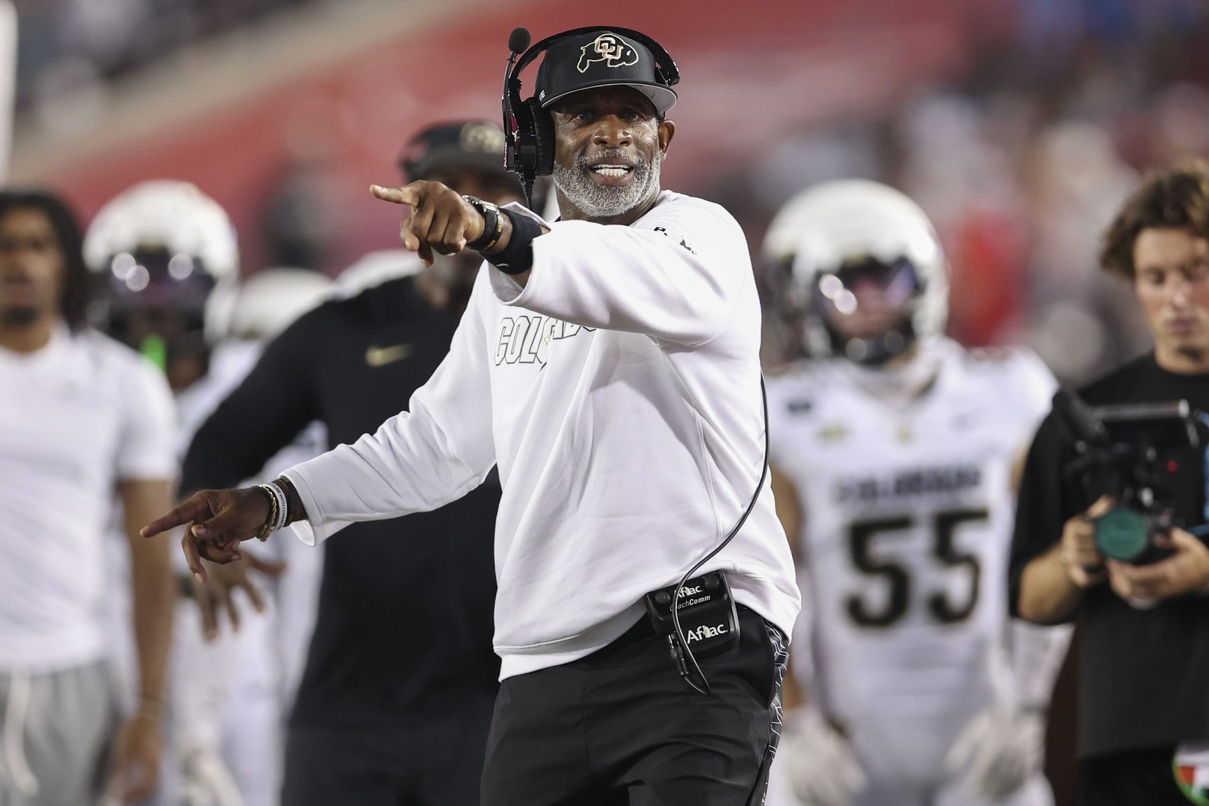 Colorado Buffaloes head coach Deion Sanders reacts after a play during the third quarter against the Houston Cougars at TDECU Stadium.