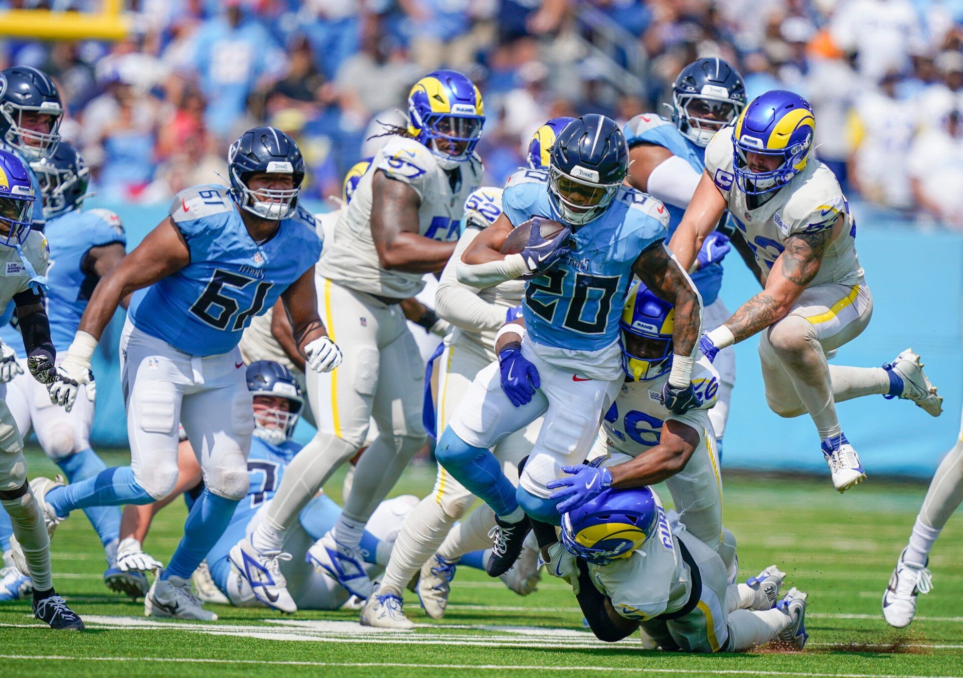 Tennessee Titans running back Tony Pollard (20) runs up the middle against the Los Angeles Rams during the second quarter at Nissan Stadium in Nashville, Tenn., Sunday, Sept. 14, 2025.