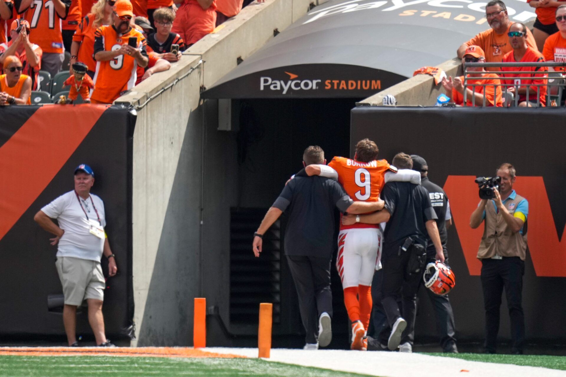 Cincinnati Bengals quarterback Joe Burrow (9) is assisted to the locker room with an injury in the second quarter of the NFL Week 2 game between the Cincinnati Bengals and the Jacksonville Jaguars at Paycor Stadium in downtown Cincinnati on Sunday, Sept. 14, 2025. The Jaguars led 17-10 at halftime.