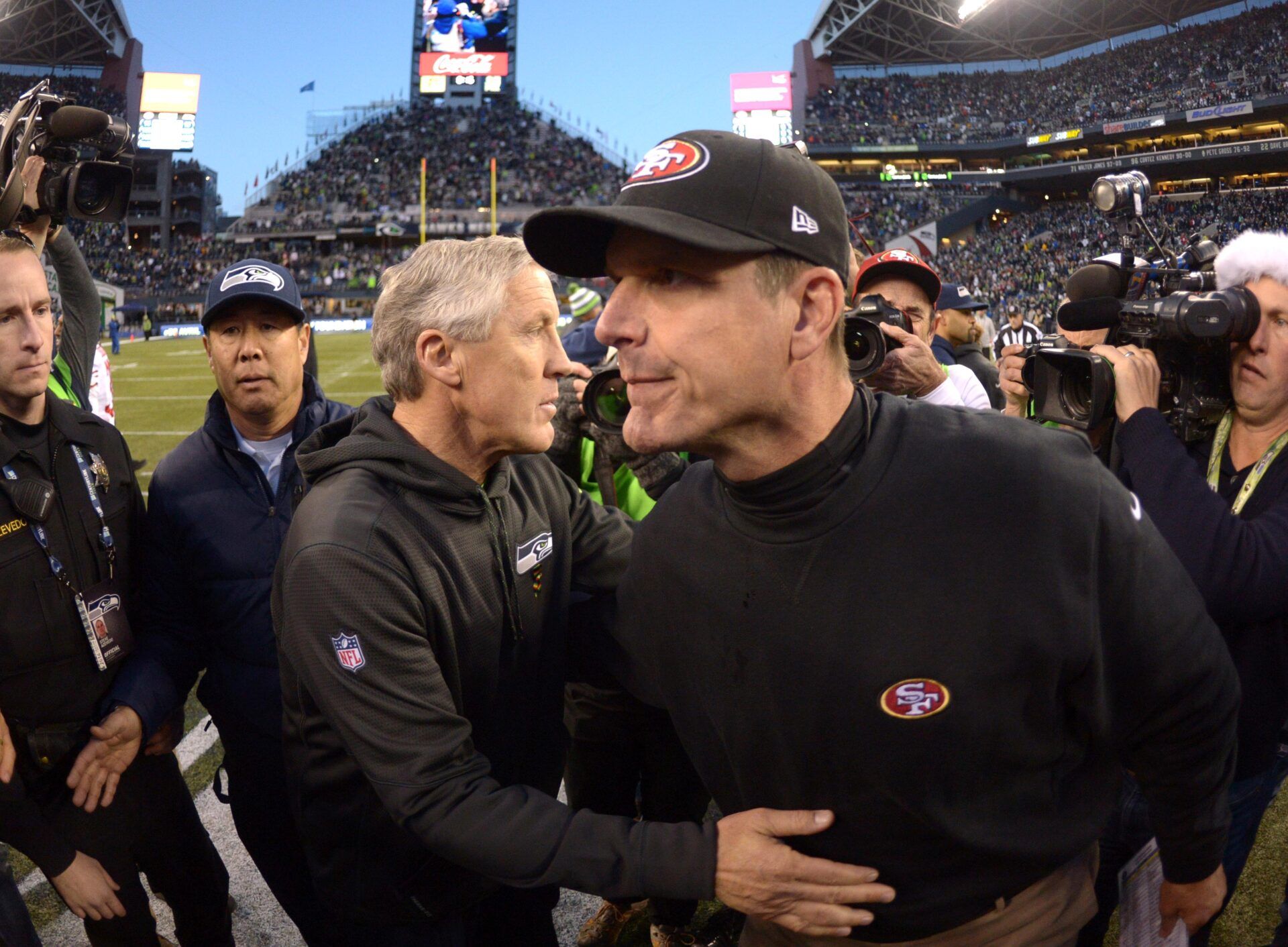 Seattle Seahawks coach Pete Carroll (left) and San Francisco 49ers coach Jim Harbaugh shake hands after the game at CenturyLink Field. The Seahawks defeated the 49ers 17-7.