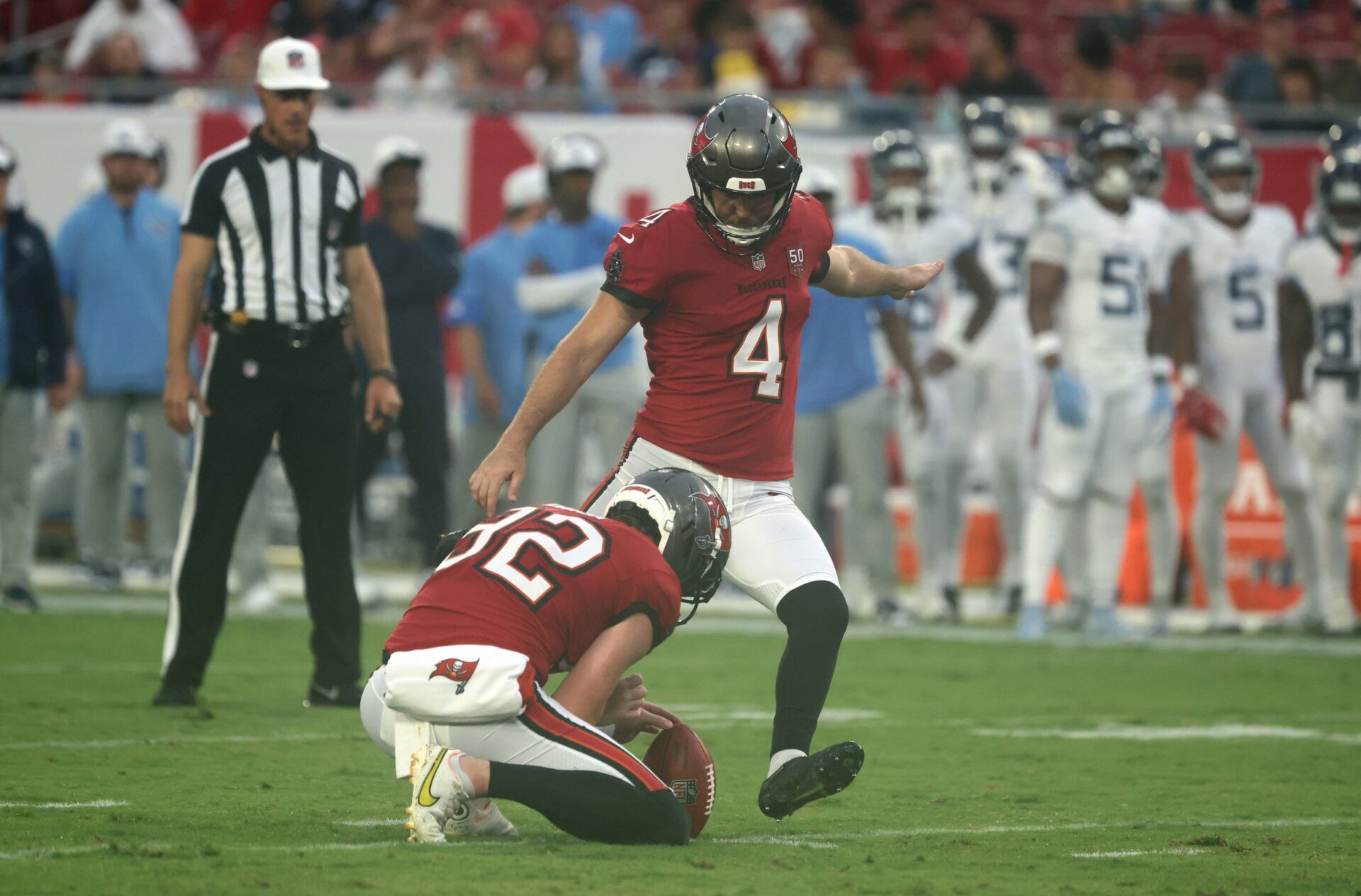 Tampa Bay Buccaneers place kicker Chase McLaughlin (4) kicks a 45-yard field goal against the Tennessee Titans during the first quarter at Raymond James Stadium.