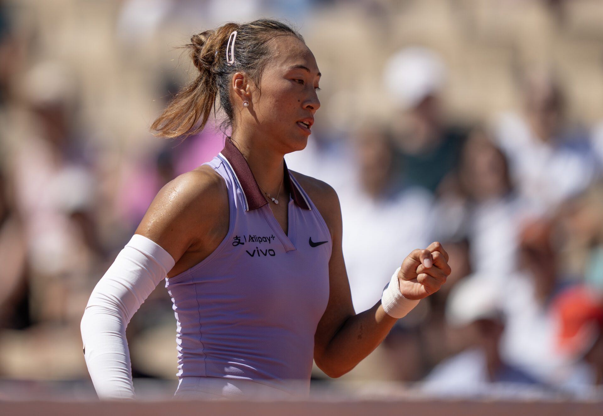Qinwen Zheng  of China reacts to a point during her match against Victoria Mboko of Canada on day six at Roland Garros Stadium.