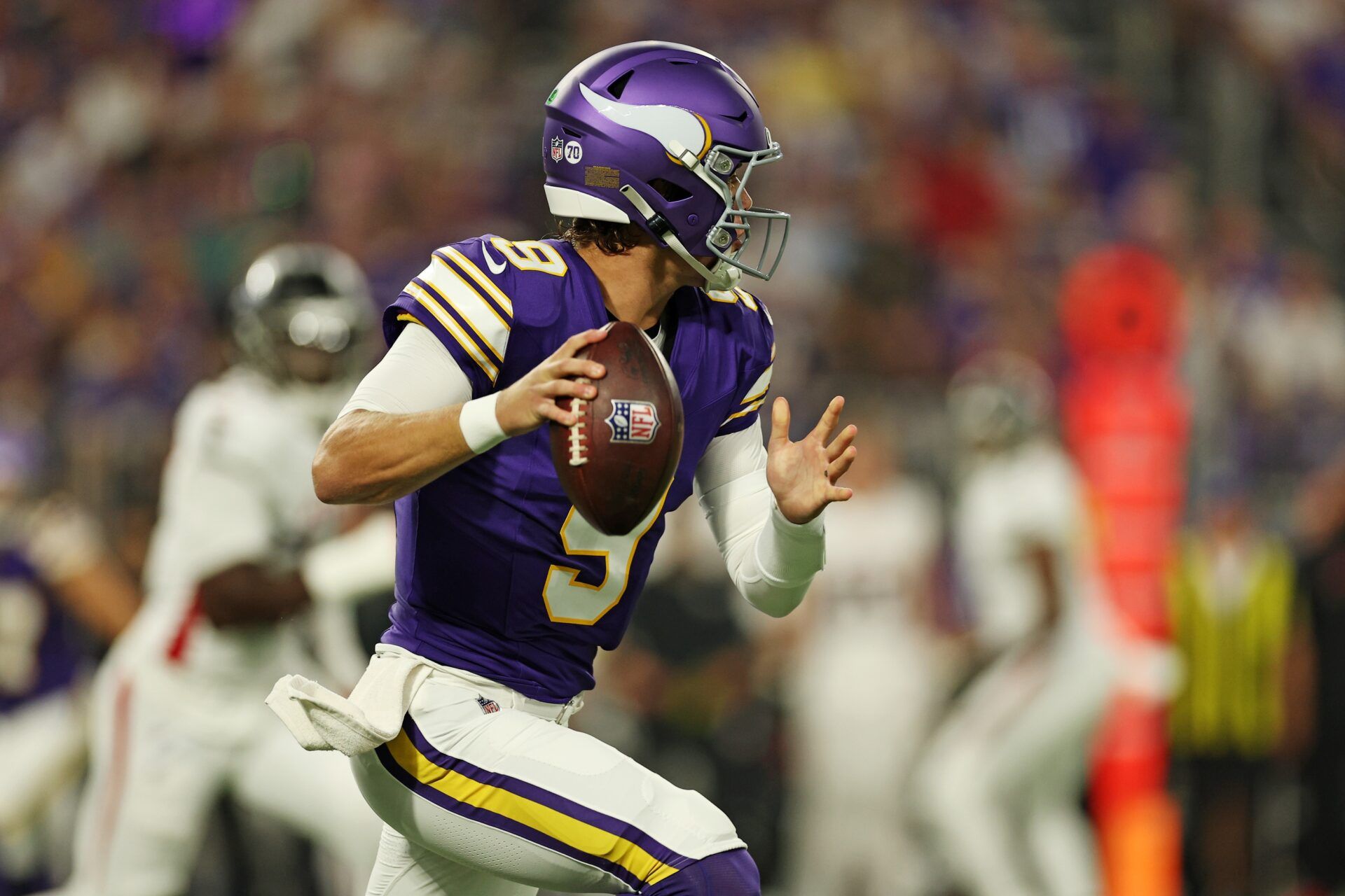 Minnesota Vikings quarterback J.J. McCarthy (9) looks to make a pass during the first half against the Atlanta Falcons at U.S. Bank Stadium.