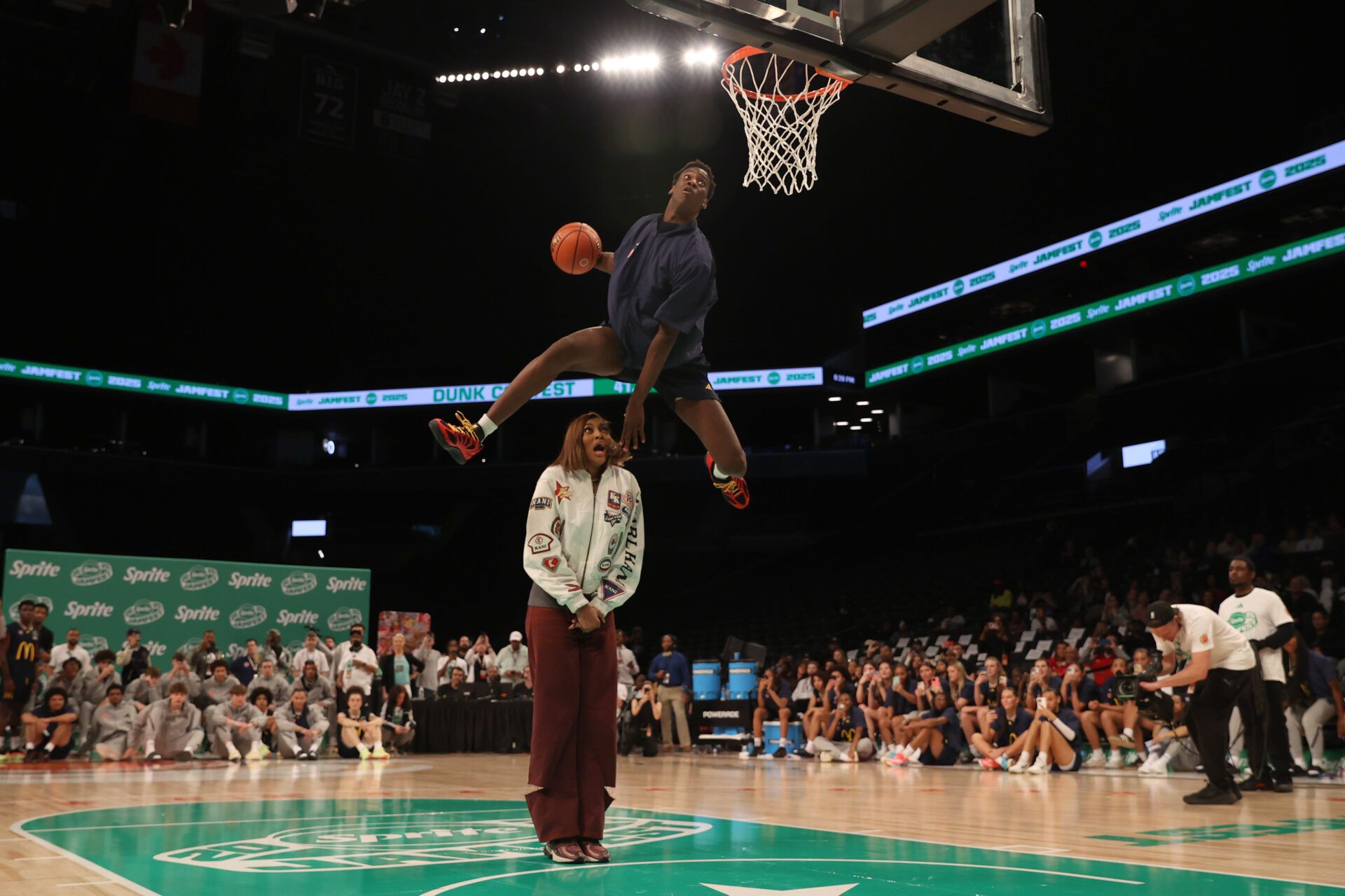 McDonald’s All American West forward AJ Dybantsa (3) dunks the ball over  Chicago Sky forward Angel Reese during the Sprite Jam Fest at Barclay's Center.
