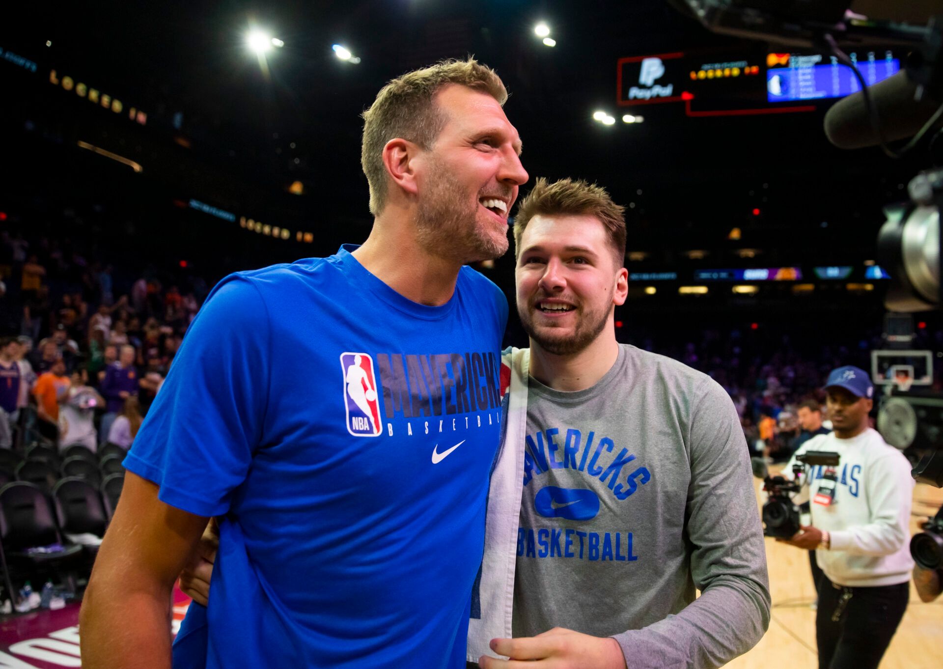 Dallas Mavericks oguard Luka Doncic (right) with former player Dirk Nowitzki against the Phoenix Suns in game seven of the second round for the 2022 NBA playoffs at Footprint Center.
