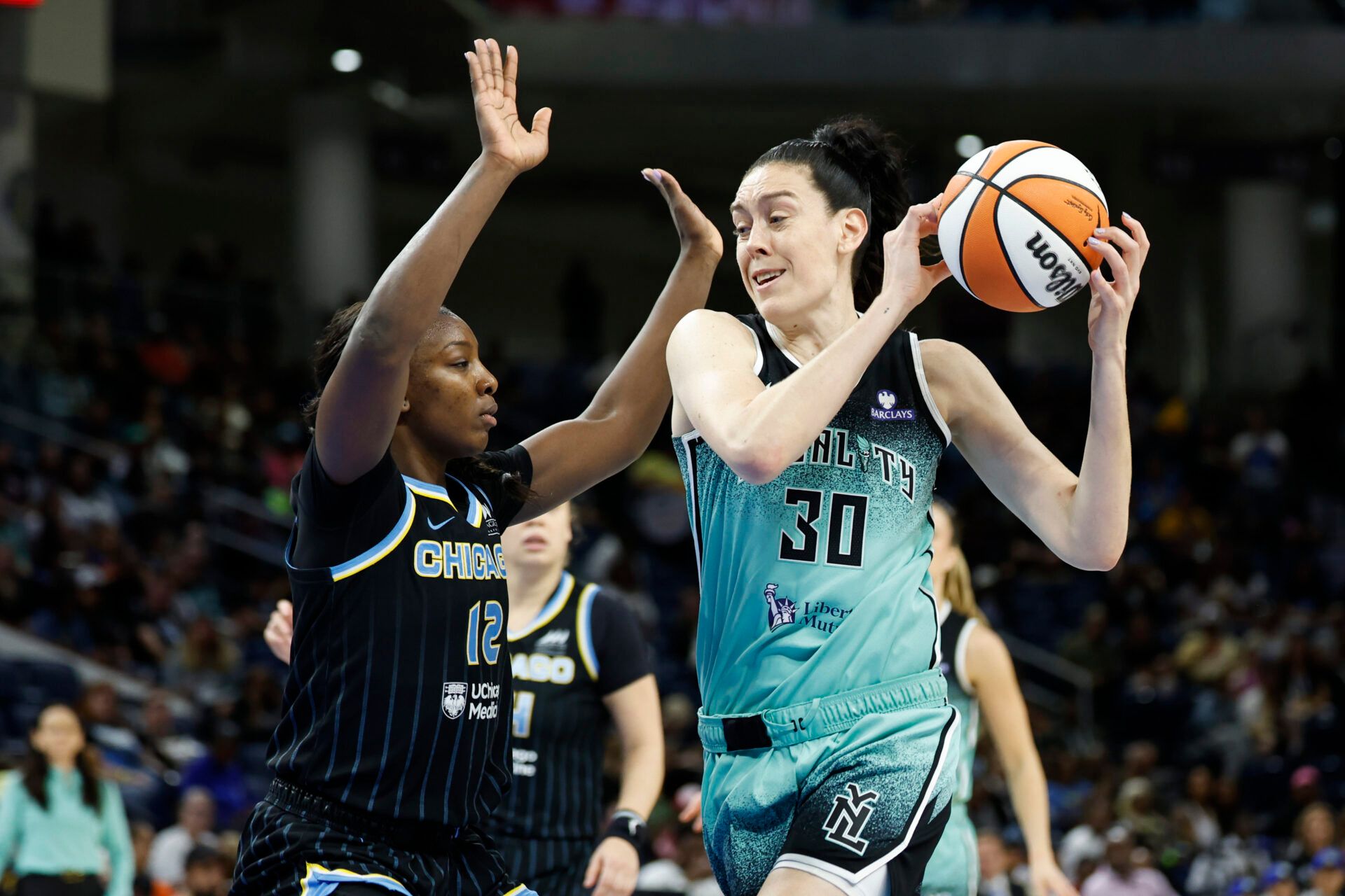 New York Liberty forward Breanna Stewart (30) drives to the basket against Chicago Sky forward Michaela Onyenwere (12) during the first half at Wintrust Arena.