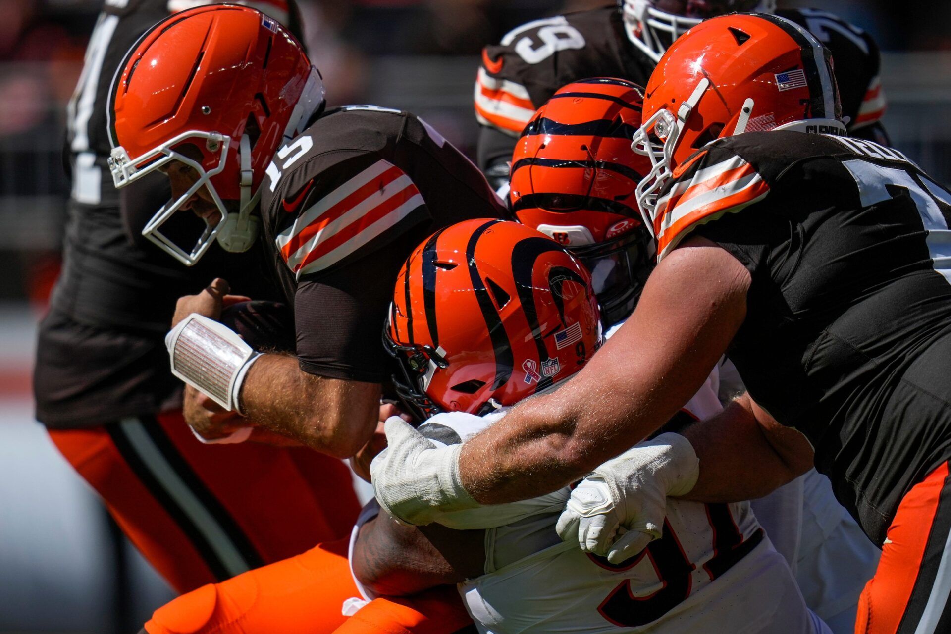 Cleveland Browns quarterback Joe Flacco (15) is sacked by Cincinnati Bengals defensive end Trey Hendrickson (91) in the fourth quarter of the NFL Week 1 game between the Cleveland Browns and the Cincinnati Bengals at Huntington Bank Field in Cleveland on Sunday, Sept. 7, 2025. The Bengals begin the season with a 17-16 win over the Browns.