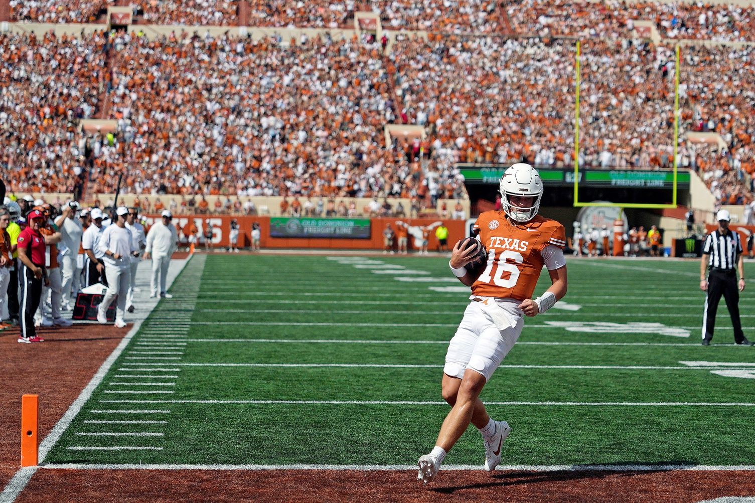 Texas Longhorns quarterback Arch Manning (16) keeps the ball for a touchdown during the first half against the Texas El Paso Miners at Darrell K Royal-Texas Memorial Stadium.