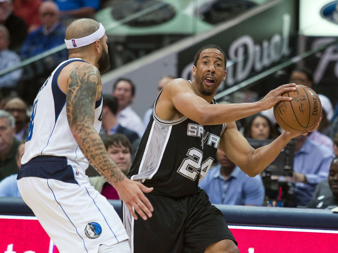 Dallas Mavericks guard Deron Williams (8) guards San Antonio Spurs guard Andre Miller (24) during the second half at the American Airlines Center. The Spurs defeat the Mavericks 96-91.