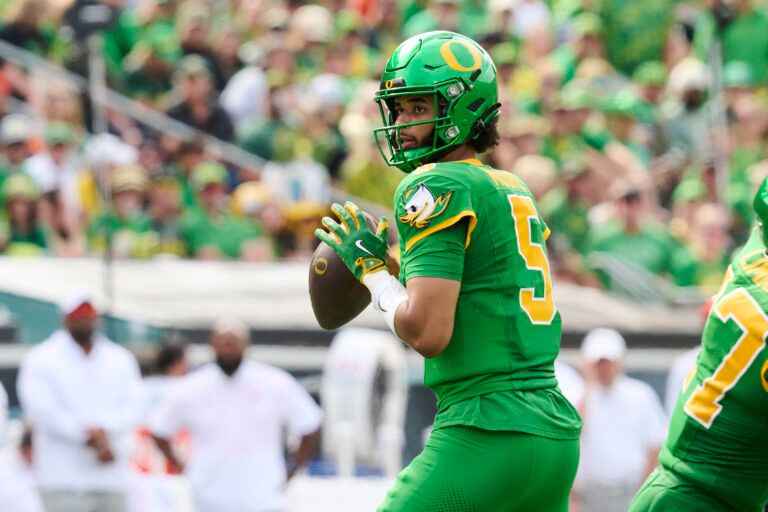 Oregon Ducks quarterback Dante Moore (5) looks down field for a receiver during the second half against the Oklahoma State Cowboys at Autzen Stadium.