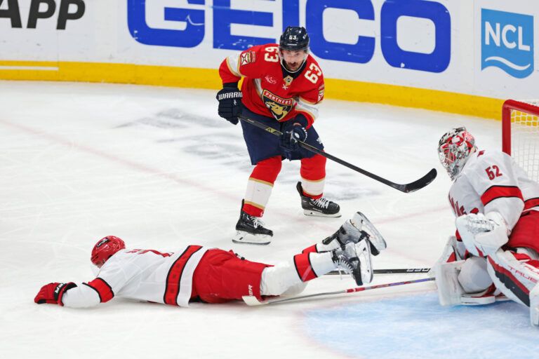 Carolina Hurricanes defenseman Jaccob Slavin (74) blocks the shot from Florida Panthers center Brad Marchand (63) during the second period in game three of the Eastern Conference Final of the 2025 Stanley Cup Playoffs at Amerant Bank Arena.