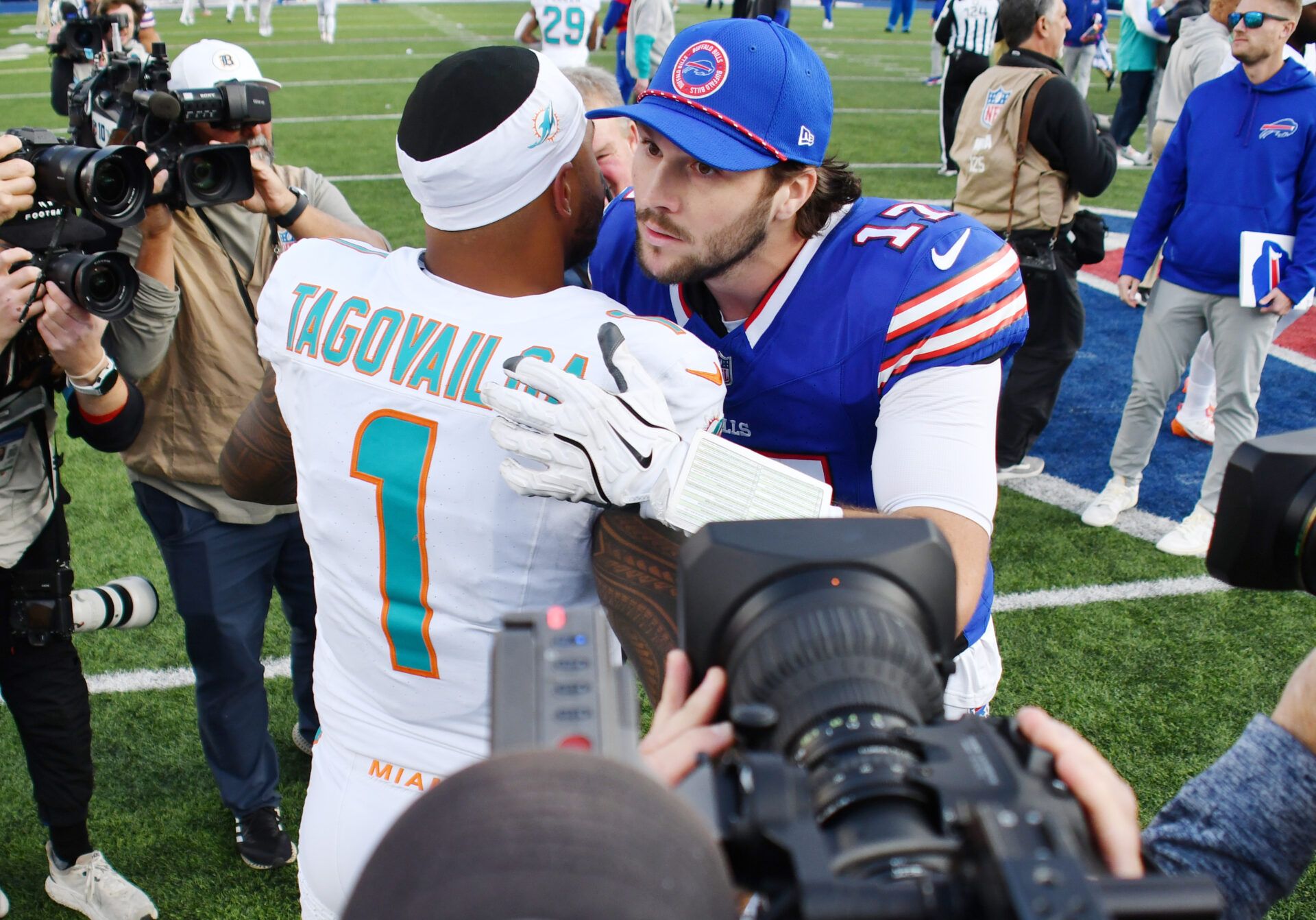 Buffalo Bills quarterback Josh Allen (17) greets Miami Dolphins quarterback Tua Tagovailoa (1) after a game at Highmark Stadium.