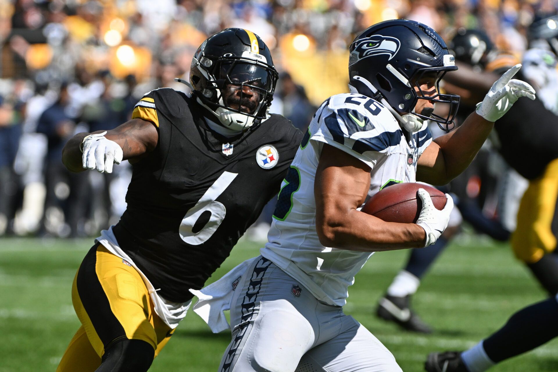 Pittsburgh Steelers linebacker Patrick Queen (6) looks to tackle Seattle Seahawks running back Zach Charbonnet (26) during the second half at Acrisure Stadium.