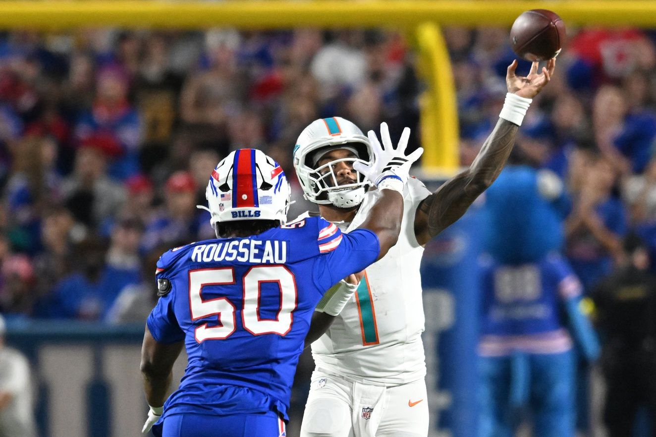 Miami Dolphins quarterback Tua Tagovailoa (1) passes against Buffalo Bills defensive end Greg Rousseau (50) in the second quarter at Highmark Stadium.