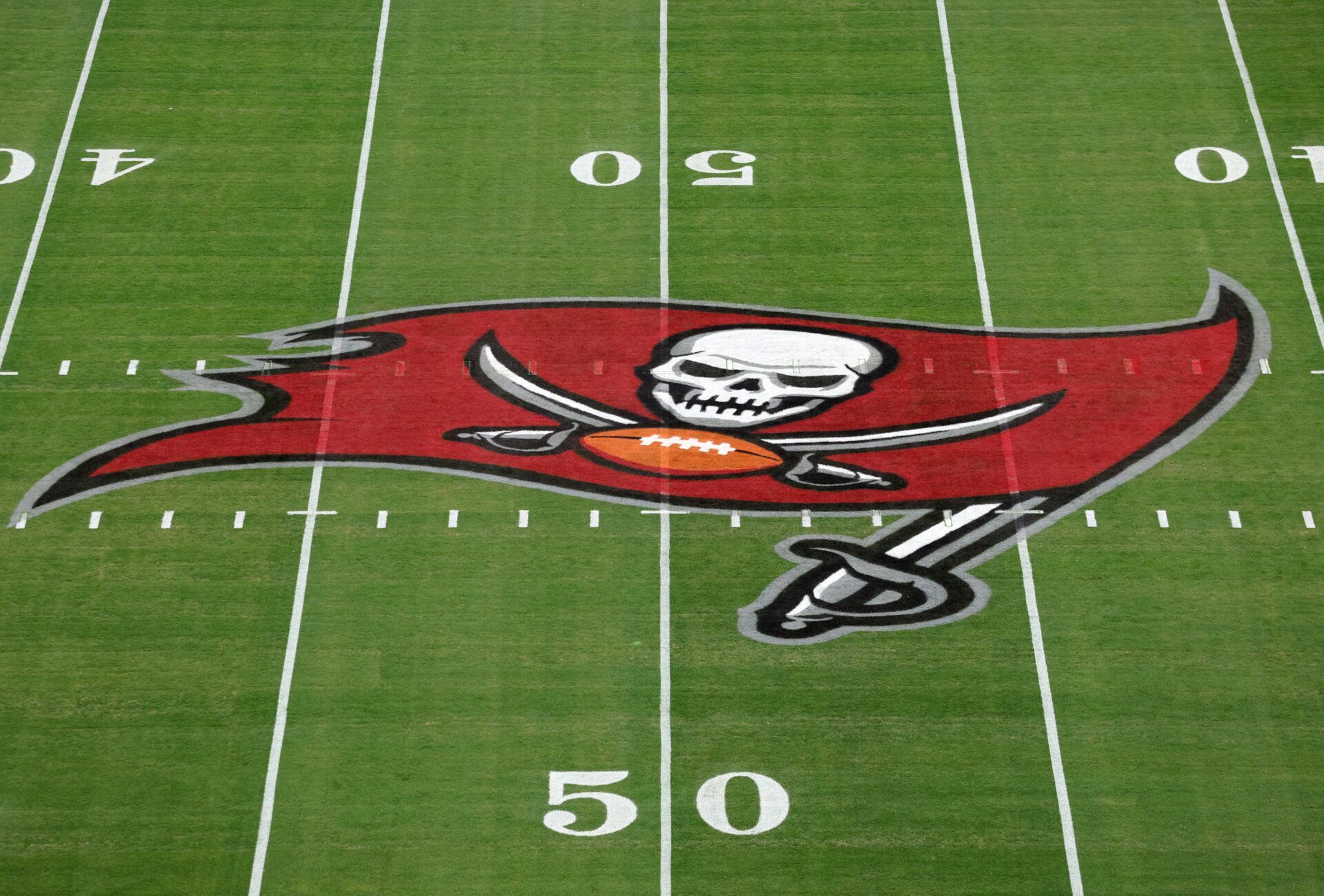 Tampa Bay Buccaneers logo at midfield before a NFC wild card playoff game between the Washington Commanders and Tampa Bay Buccaneers at Raymond James Stadium.