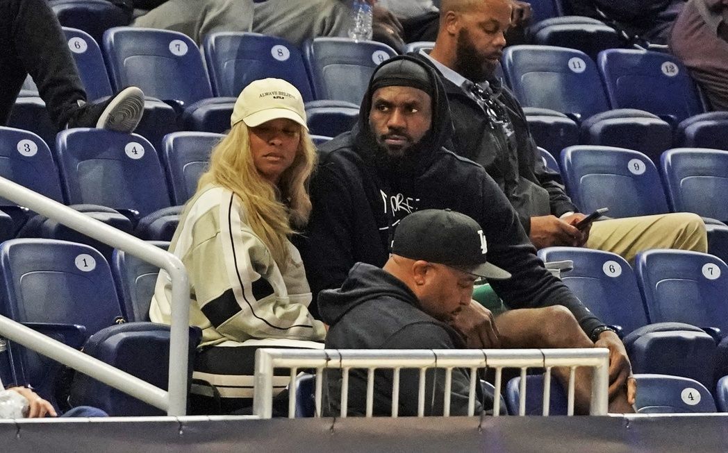 LeBron James and his wife Savannah Brinson watch Bronny James participate in the 2024 NBA Draft Combine at Wintrust Arena.