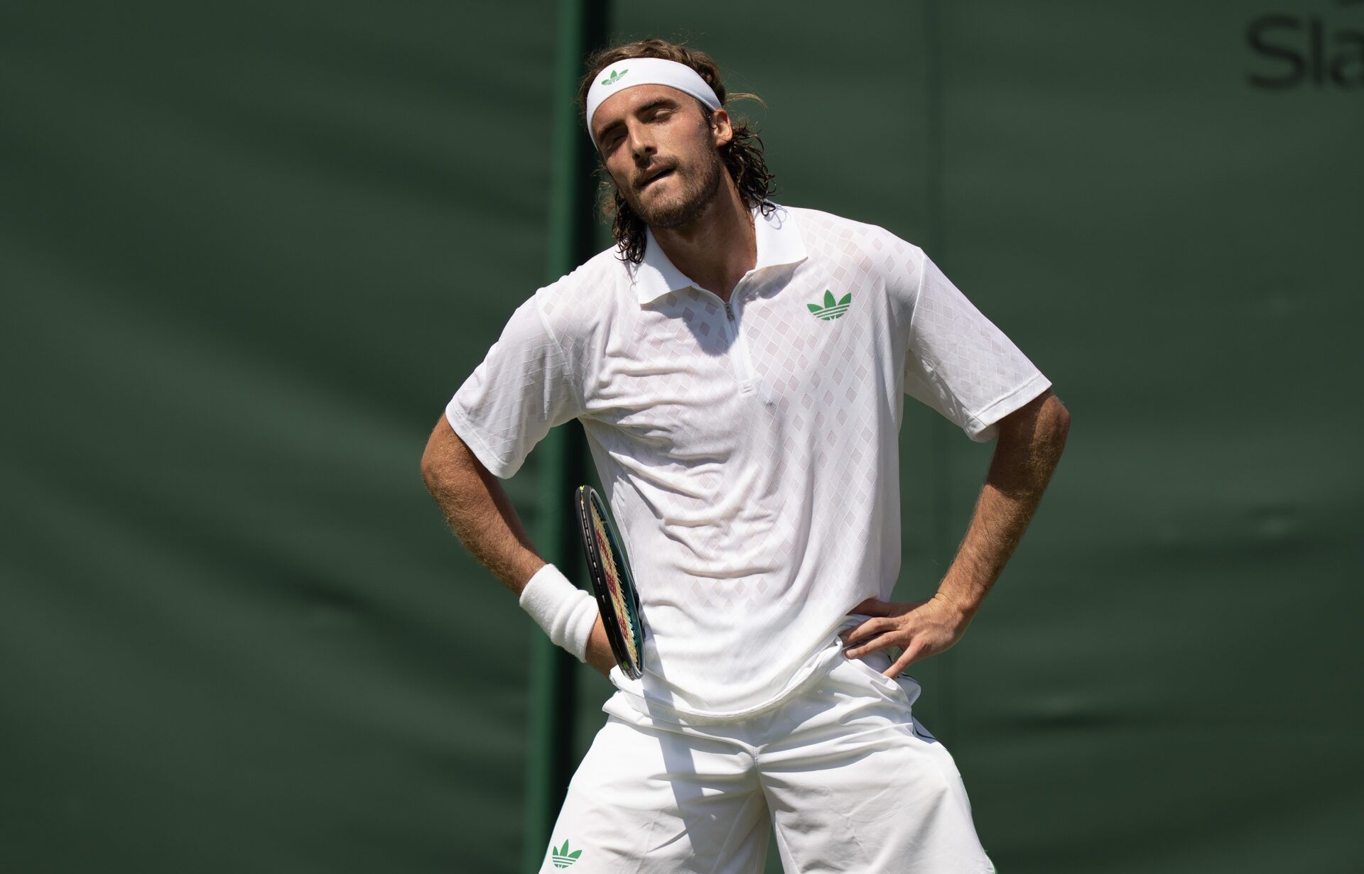 Stefanos Tsitsipas of Greece reacts to a point during his match against Valentin Royer of France on day one at the All England Lawn Tennis and Croquet Club.