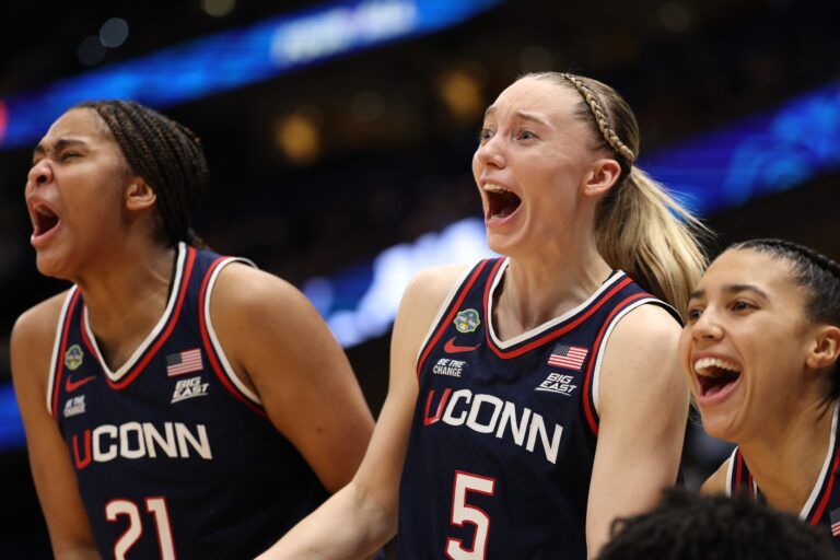 Connecticut Huskies guard Paige Bueckers (5) and forward Sarah Strong (21) react on the bench during the fourth quarter in a semifinal of the women's 2025 NCAA tournament against the UCLA Bruins at Amalie Arena.