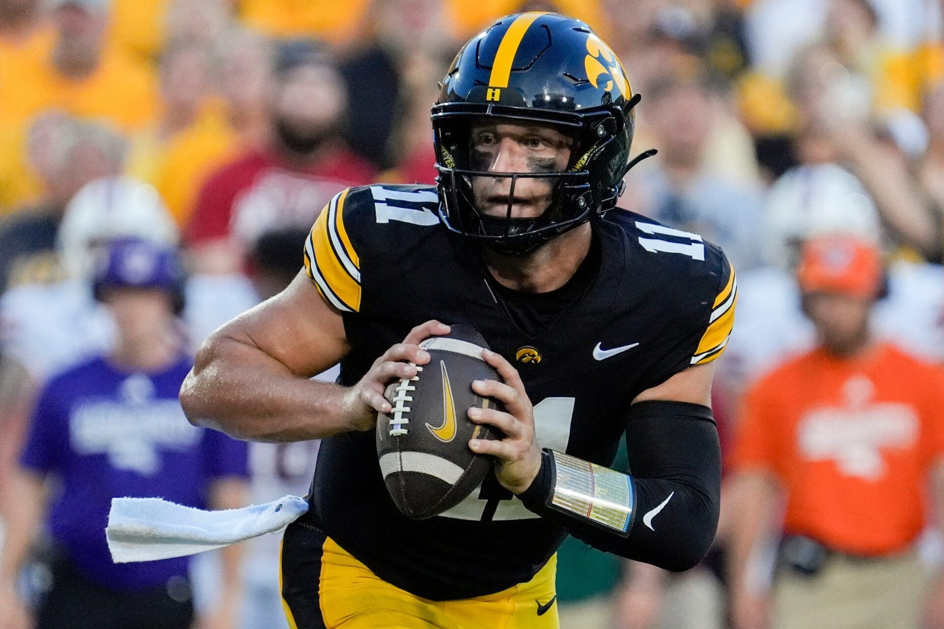 Iowa Hawkeyes quarterback Mark Gronowski (11) looks to pass the ball during a football game against the Massachusetts Minutemen Sept. 13, 2025 at Kinnick Stadium in Iowa City, Iowa.