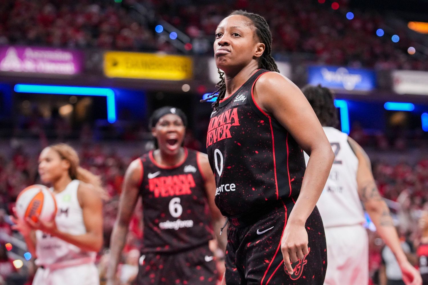 Indiana Fever guard Kelsey Mitchell (0) celebrates Tuesday, Sept. 16, 2025, during Game 2 of a WNBA playoff matchup between the Indiana Fever and the Atlanta Dream at Gainbridge Fieldhouse in Indianapolis. The Indiana Fever defeated the Atlanta Dream, 77-60.