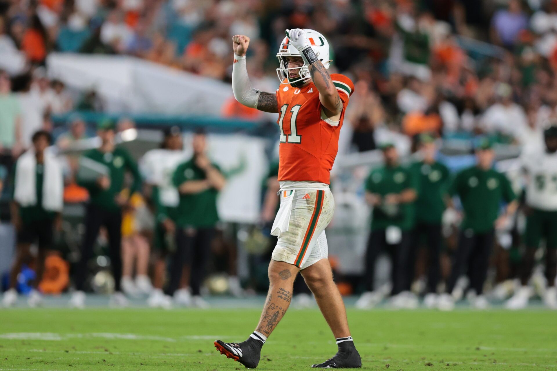 Miami Hurricanes quarterback Carson Beck (11) reacts against the South Florida Bulls during the third quarter at Hard Rock Stadium.