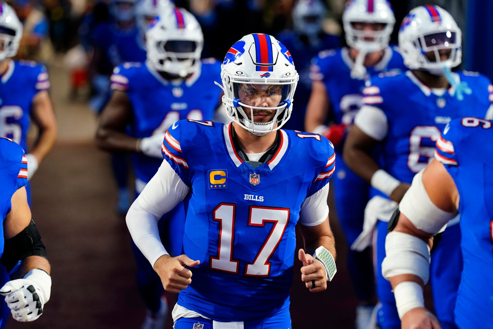 Buffalo Bills quarterback Josh Allen (17) runs onto the field before the game against the Miami Dolphins at Highmark Stadium.