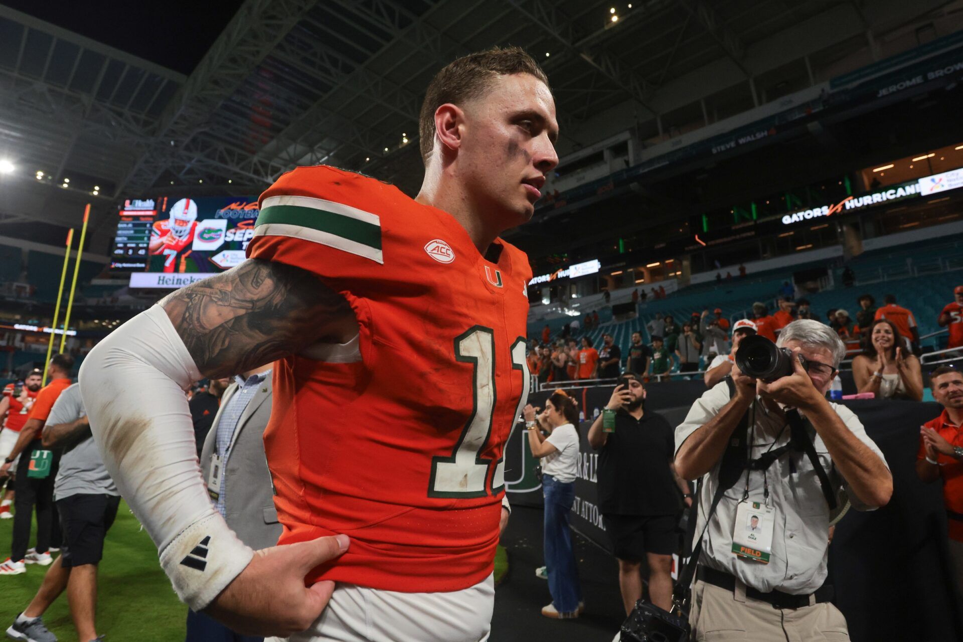 Miami Hurricanes quarterback Carson Beck (11) walks off the field after the game against the South Florida Bulls at Hard Rock Stadium.