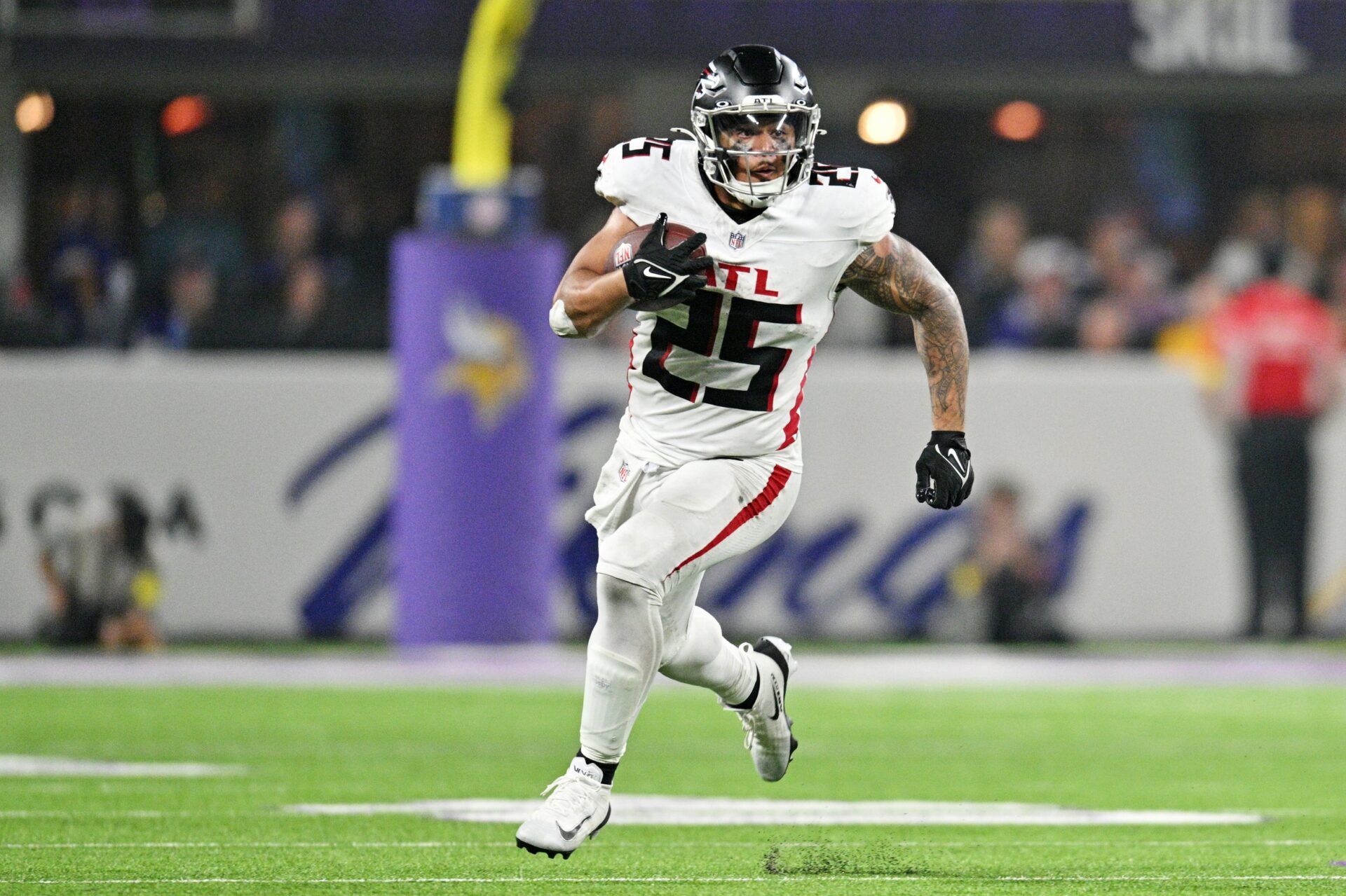 Atlanta Falcons running back Tyler Allgeier (25) runs the ball during the second half against the Minnesota Vikings at U.S. Bank Stadium.
