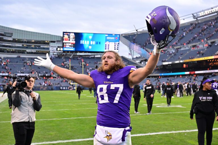 Minnesota Vikings tight end T.J. Hockenson (87) celebrates after the game against the Chicago Bears at Soldier Field.