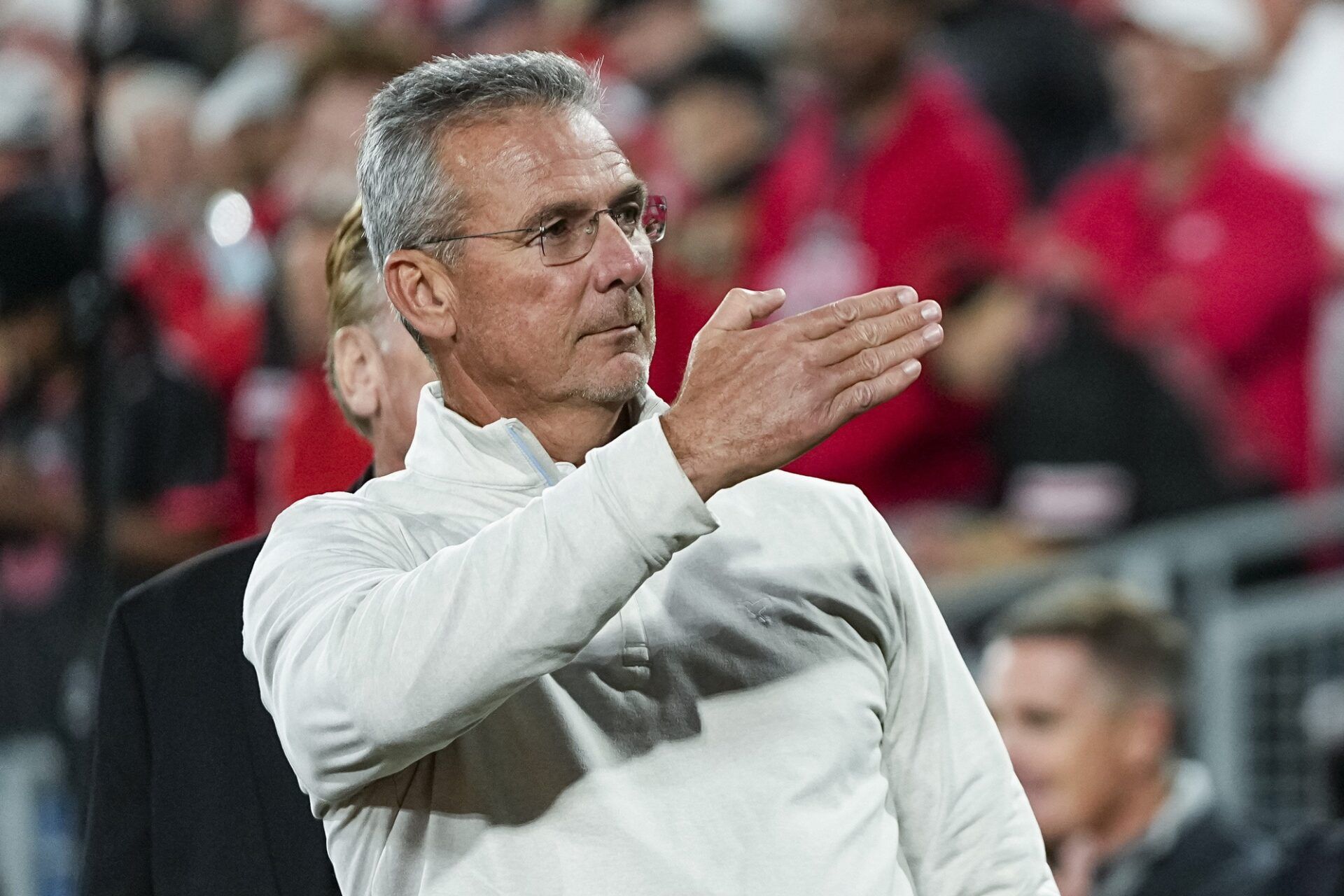 Former Ohio State Buckeyes head coach Urban Meyer salutes the fans chanting his name during the College Football Playoff quarterfinal against the Oregon Ducks at the Rose Bowl in Pasadena, Calif. on Jan. 1, 2025. Ohio State won 41-21.