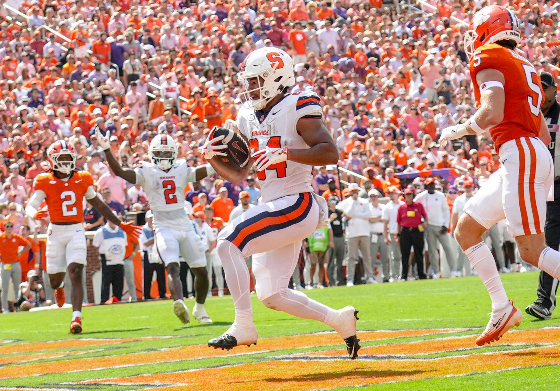 Syracuse Orange running back Will Nixon (24) scores a touchdown agains the Clemson Tigers during the second quarter at Memorial Stadium.