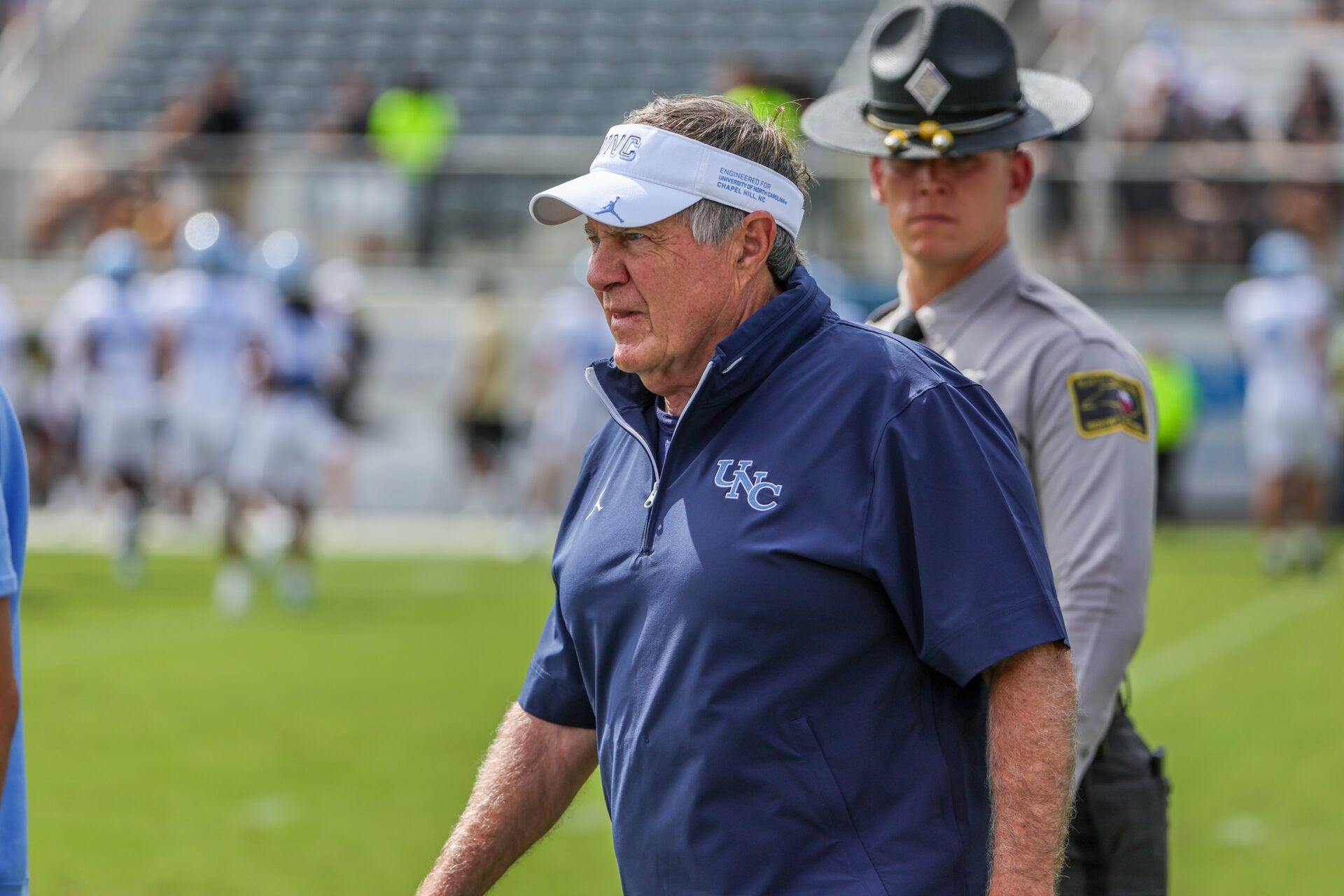 North Carolina Tar Heels head coach Bill Belichick walks into the field before the game against the UCF Knights at the Bounce House Stadium.