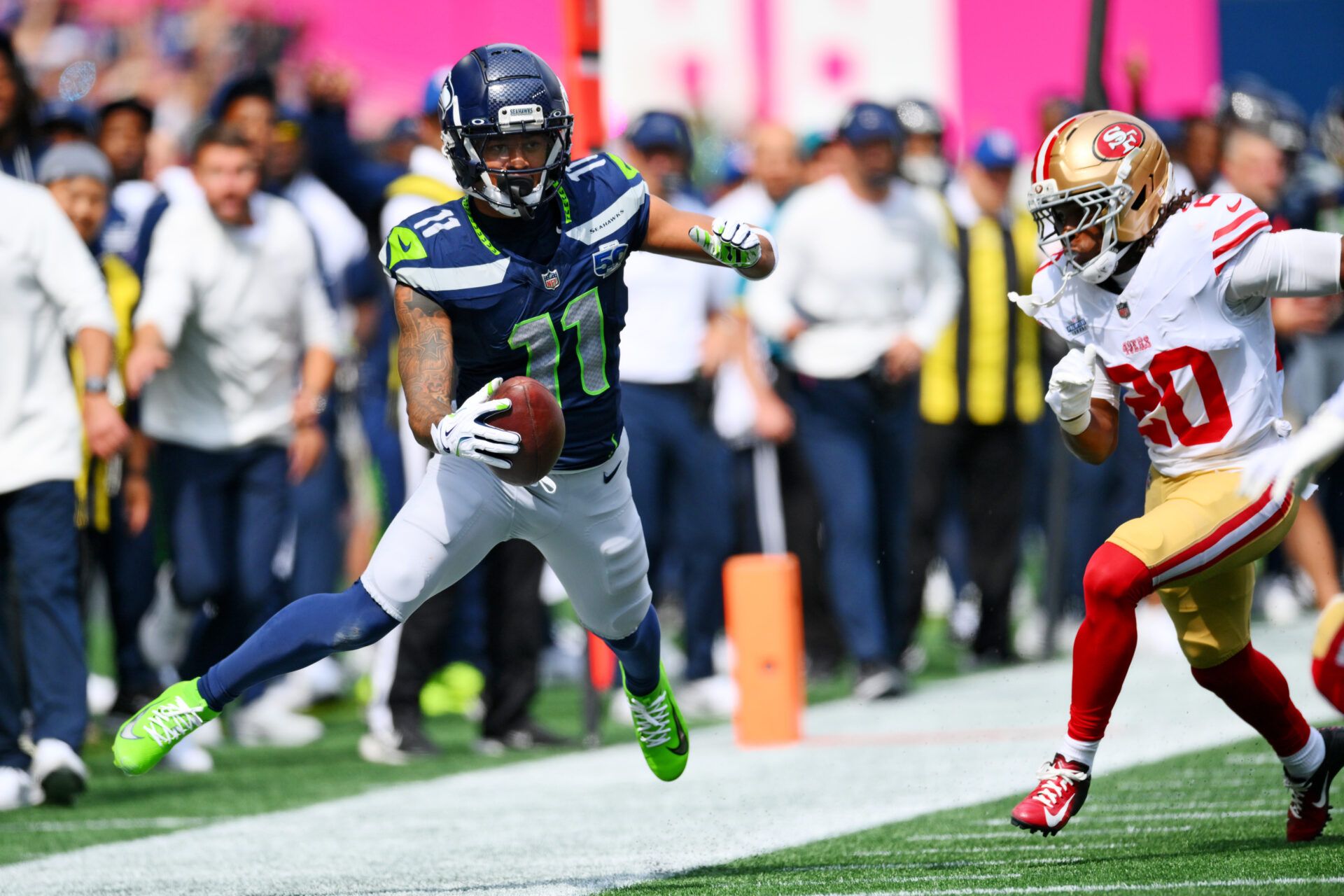 Seattle Seahawks wide receiver Jaxon Smith-Njigba (11) runs the ball during the first half against San Francisco 49ers at Lumen Field.