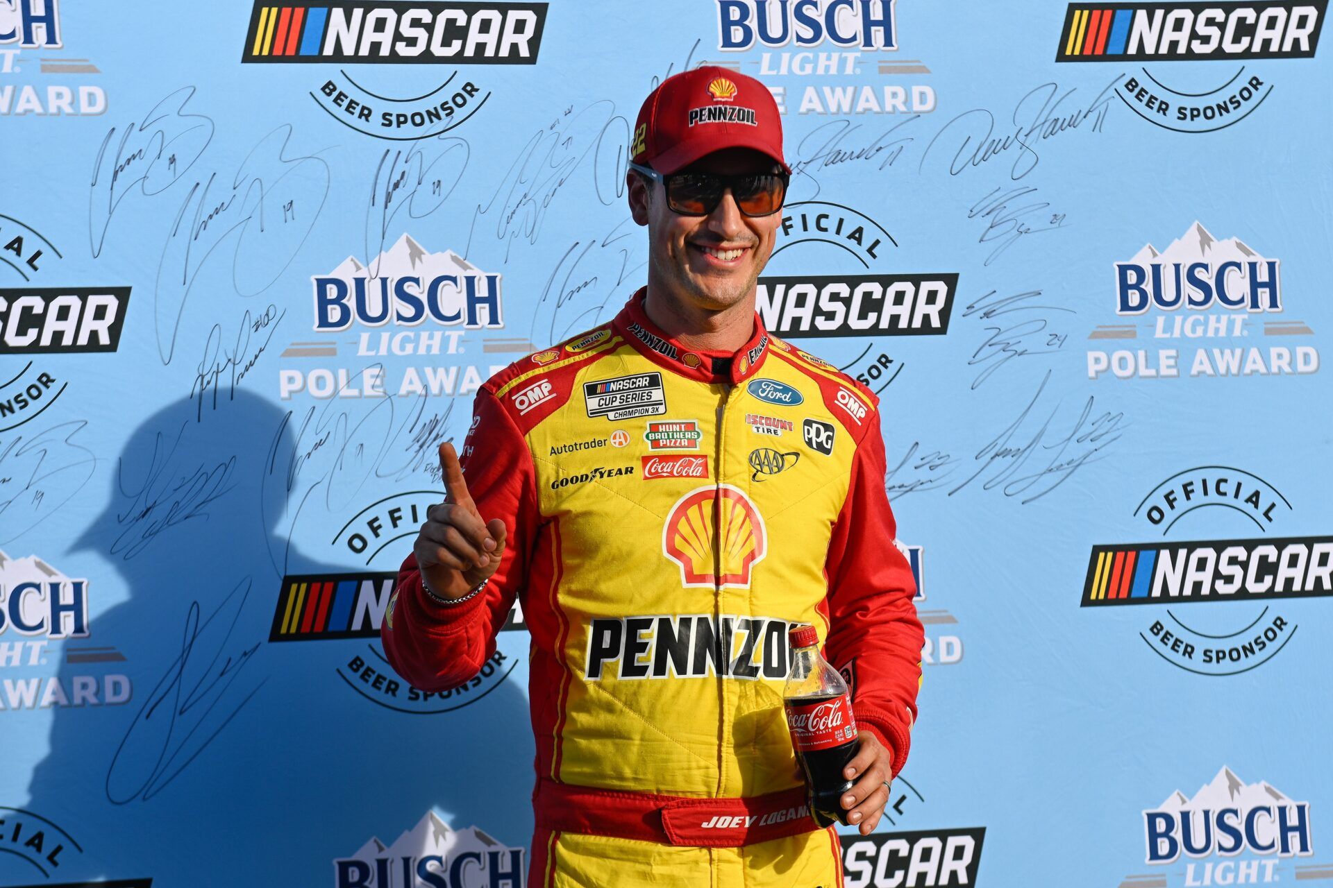 NASCAR Cup Series driver Joey Logano (22) celebrates winning the starting pole position for the the Mobil 1 301 at New Hampshire Motor Speedway.