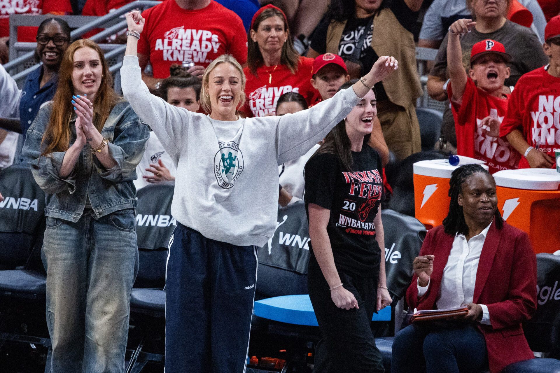 Indiana Fever guard Caitlin Clark (22) and guard Sophie Cunningham (8) on the sideline during game two of round one against the Atlanta Dream for the 2025 WNBA Playoffs at Gainbridge Fieldhouse.