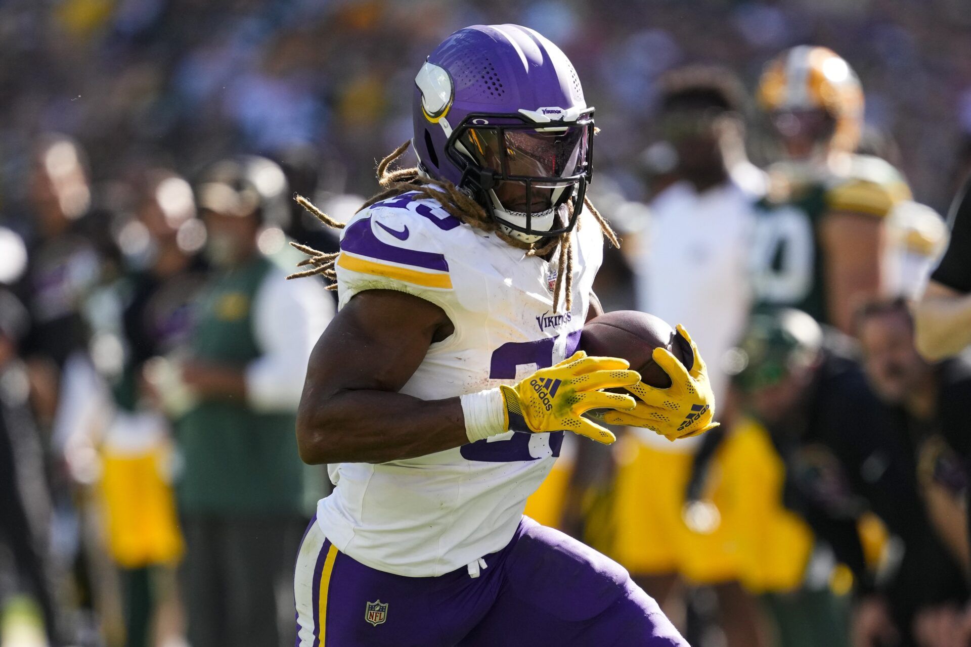 Minnesota Vikings running back Aaron Jones (33) rushes with the football during the fourth quarter against the Green Bay Packers at Lambeau Field.