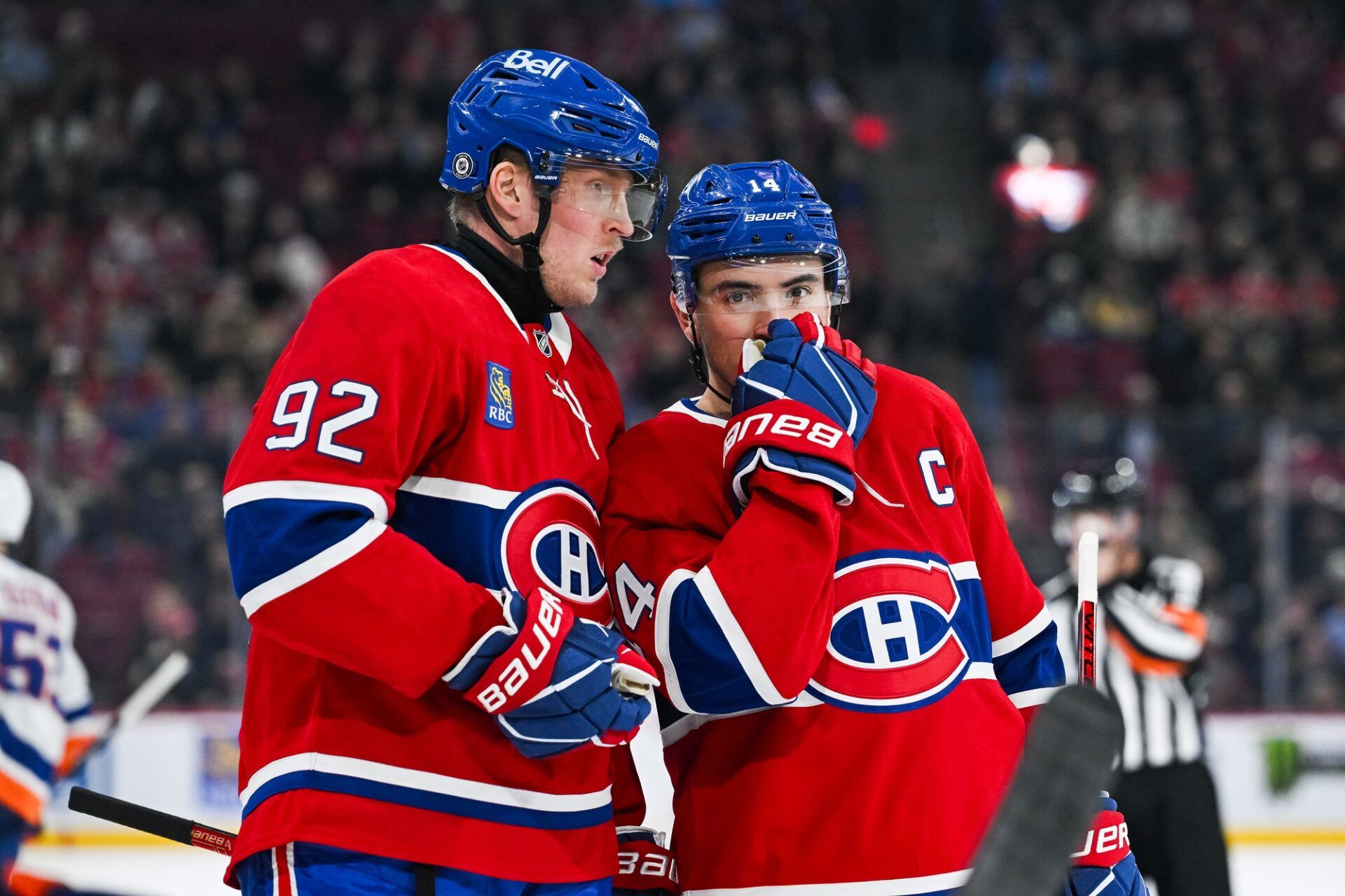 Montreal Canadiens right wing Patrik Laine (92) discusses with center Nick Suzuki (14) against the New York Islanders during the first period at Bell Centre.