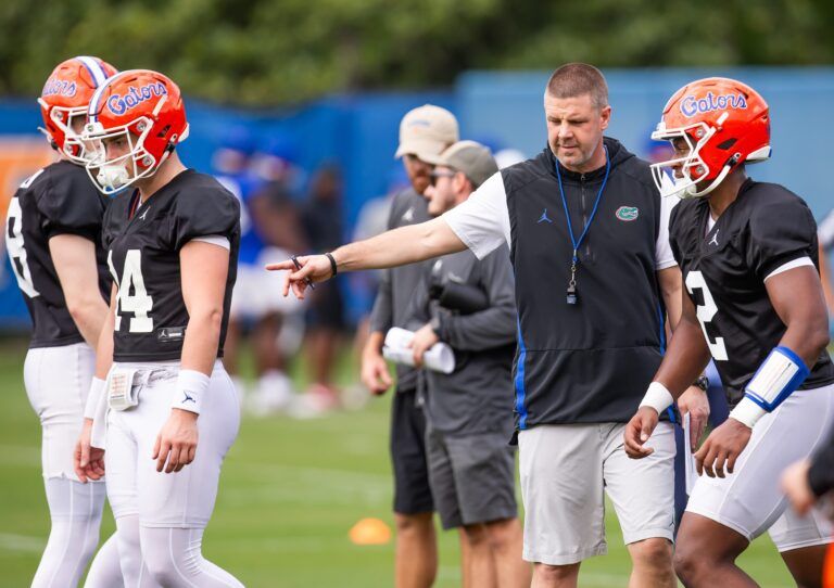 Florida quarterback DJ Lagway (2) is directed by Florida Head Coach Billy Napier watches during practice. The Florida Gators held their second Spring football practice at Sanders Practice Fields in Gainesville, FL on Saturday, March 9, 2024. [Doug Engle/Gainesville Sun]2024