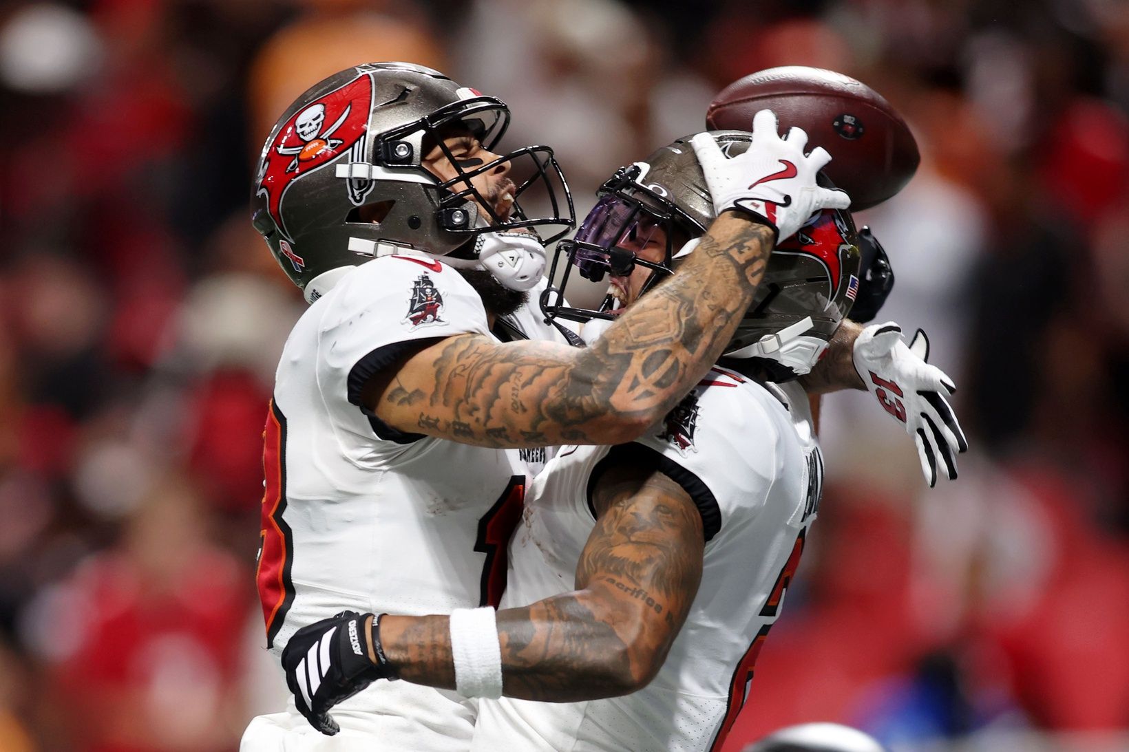 Tampa Bay Buccaneers wide receiver Mike Evans (13) celebrates with wide receiver Emeka Egbuka (2) after a touchdown against the Atlanta Falcons during the fourth quarter at Mercedes-Benz Stadium.