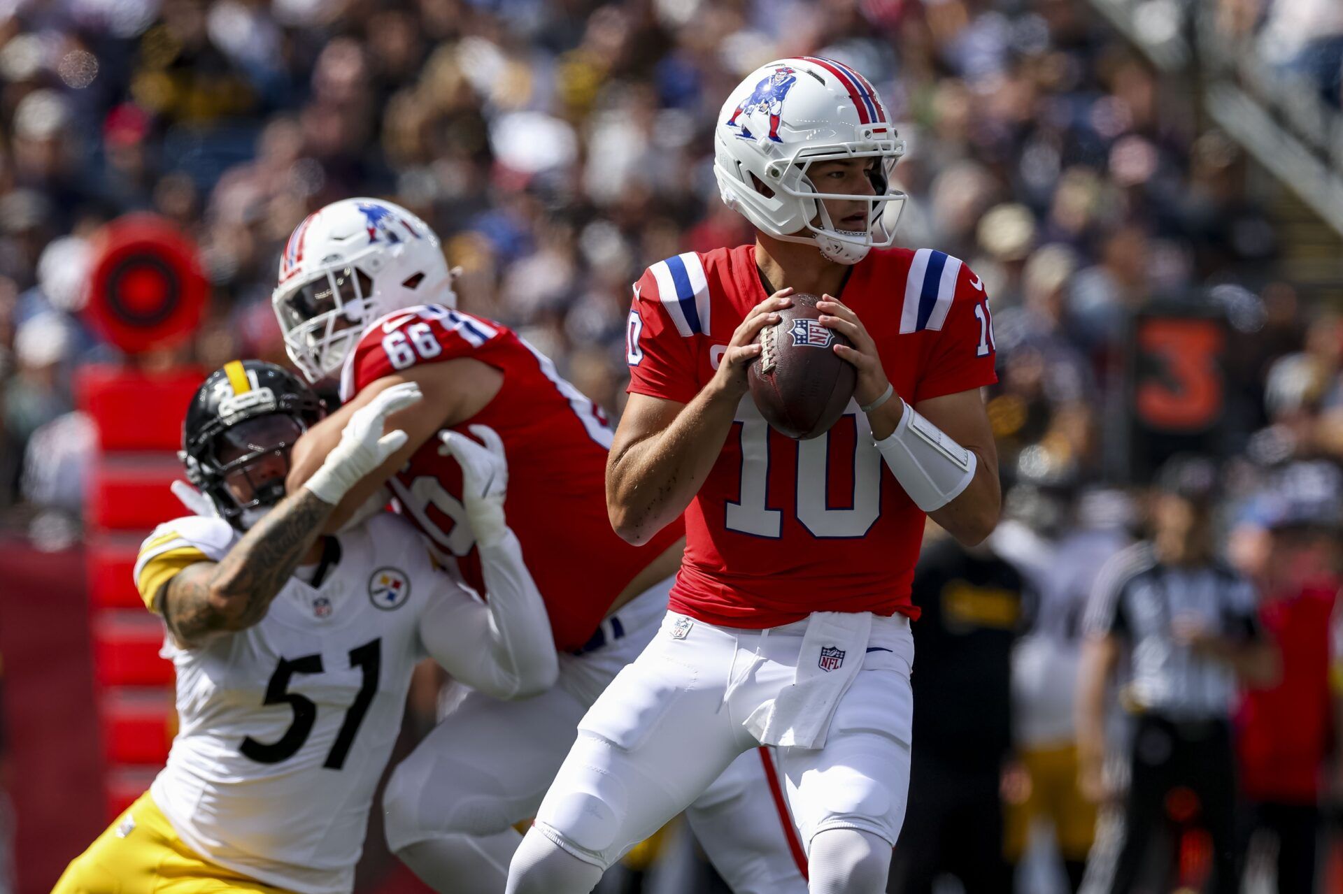 New England Patriots quarterback Drake Maye (10) looks to pass the ball during the first quarter at Gillette Stadium.