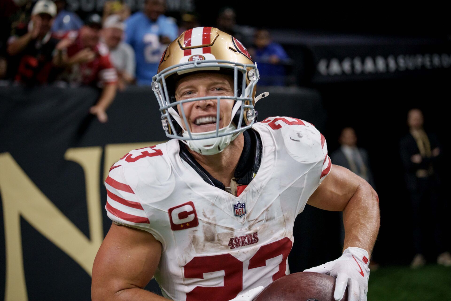 San Francisco 49ers running back Christian McCaffrey (23) reacts after catching a touchdown against the New Orleans Saints during the second quarter at Caesars Superdome.