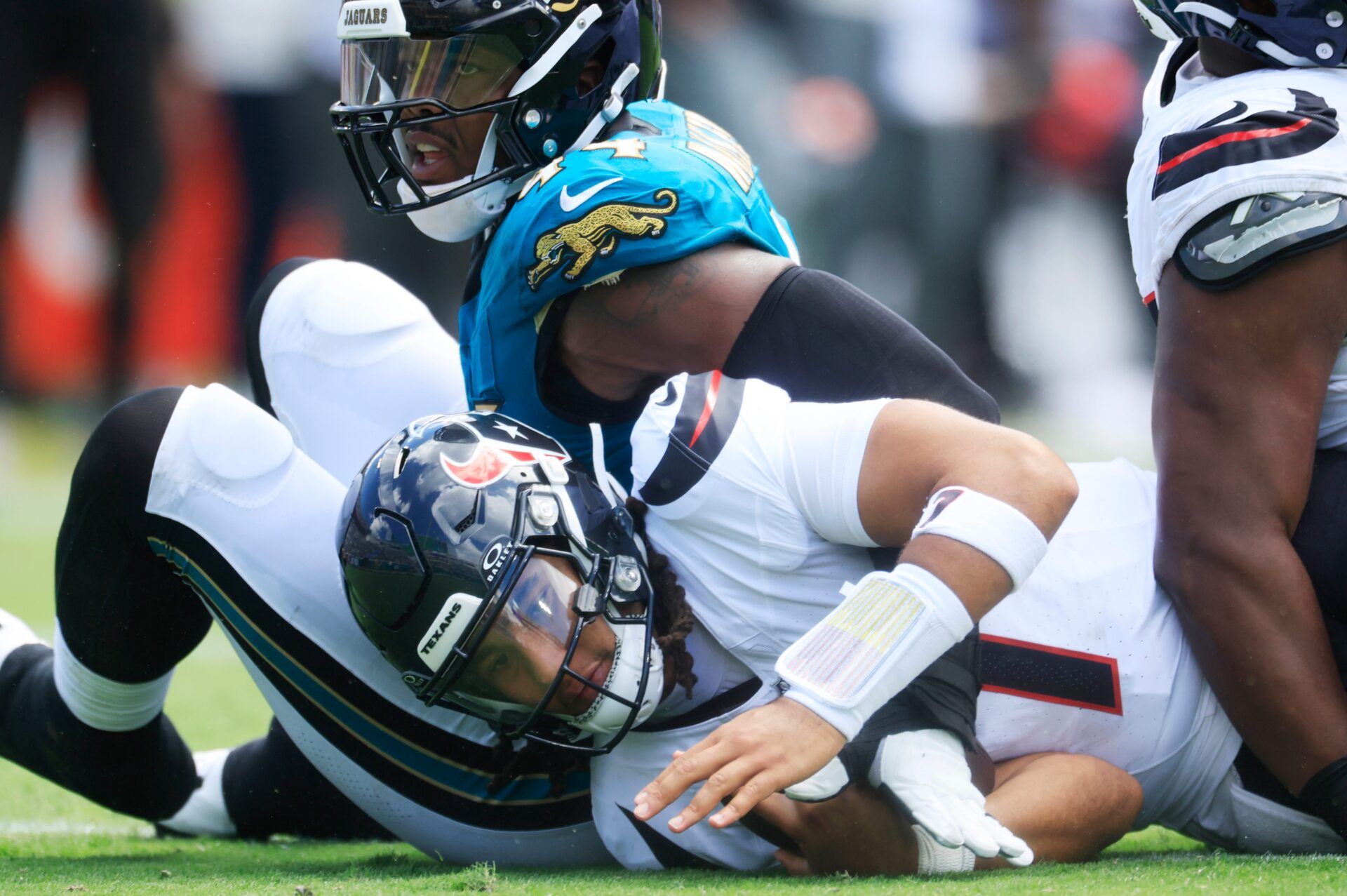 Houston Texans quarterback CJ. Stroud (7) is sacked by Jacksonville Jaguars defensive end Travon Walker (44) during the first quarter of an NFL football matchup at EverBank Stadium, Sunday, Sept. 21, 2025, in Jacksonville, Fla. [Corey Perrine/Florida Times-Union]