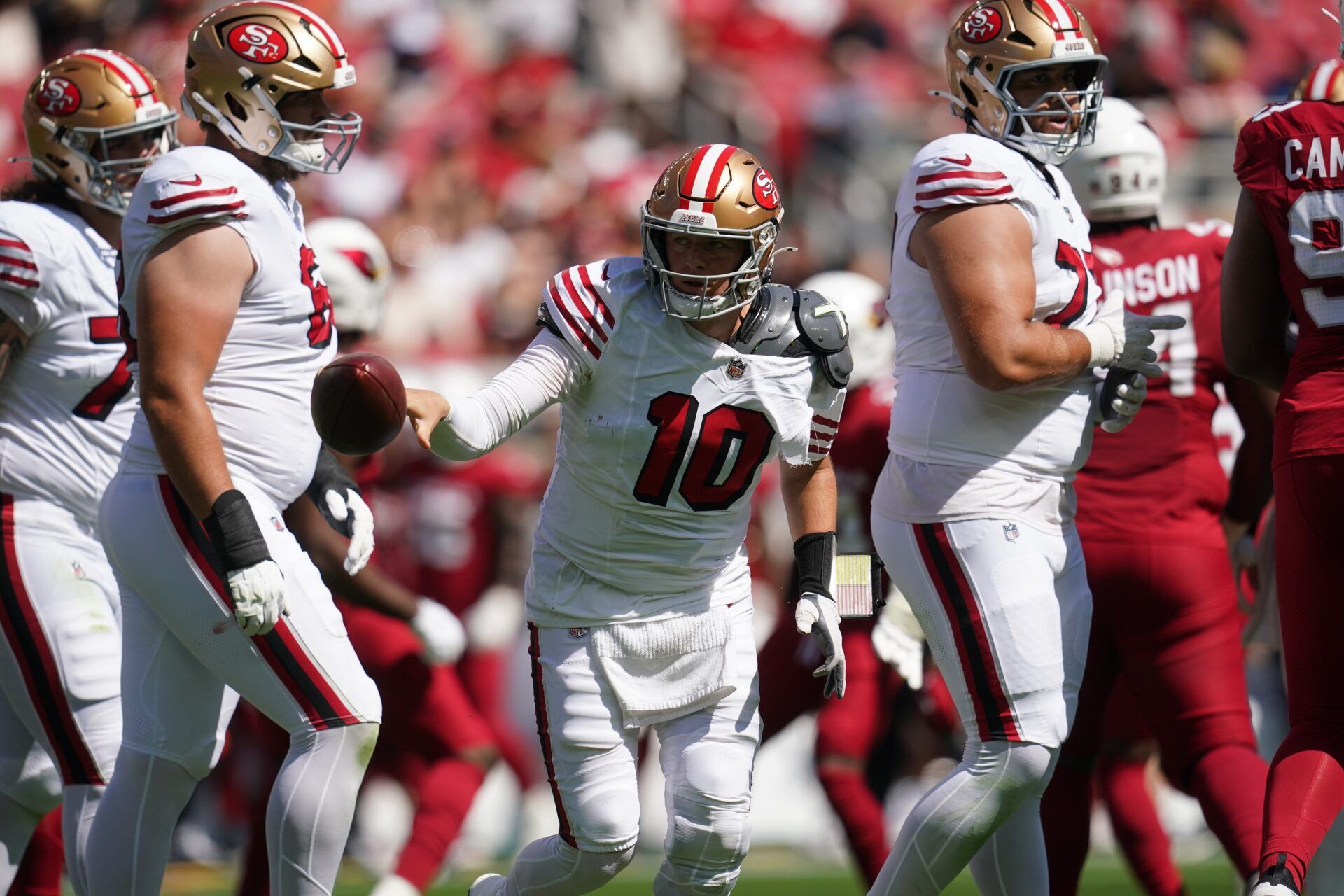 San Francisco 49ers quarterback Mac Jones (10) reacts after being tackled by the Arizona Cardinals during the first half at Levi's Stadium.